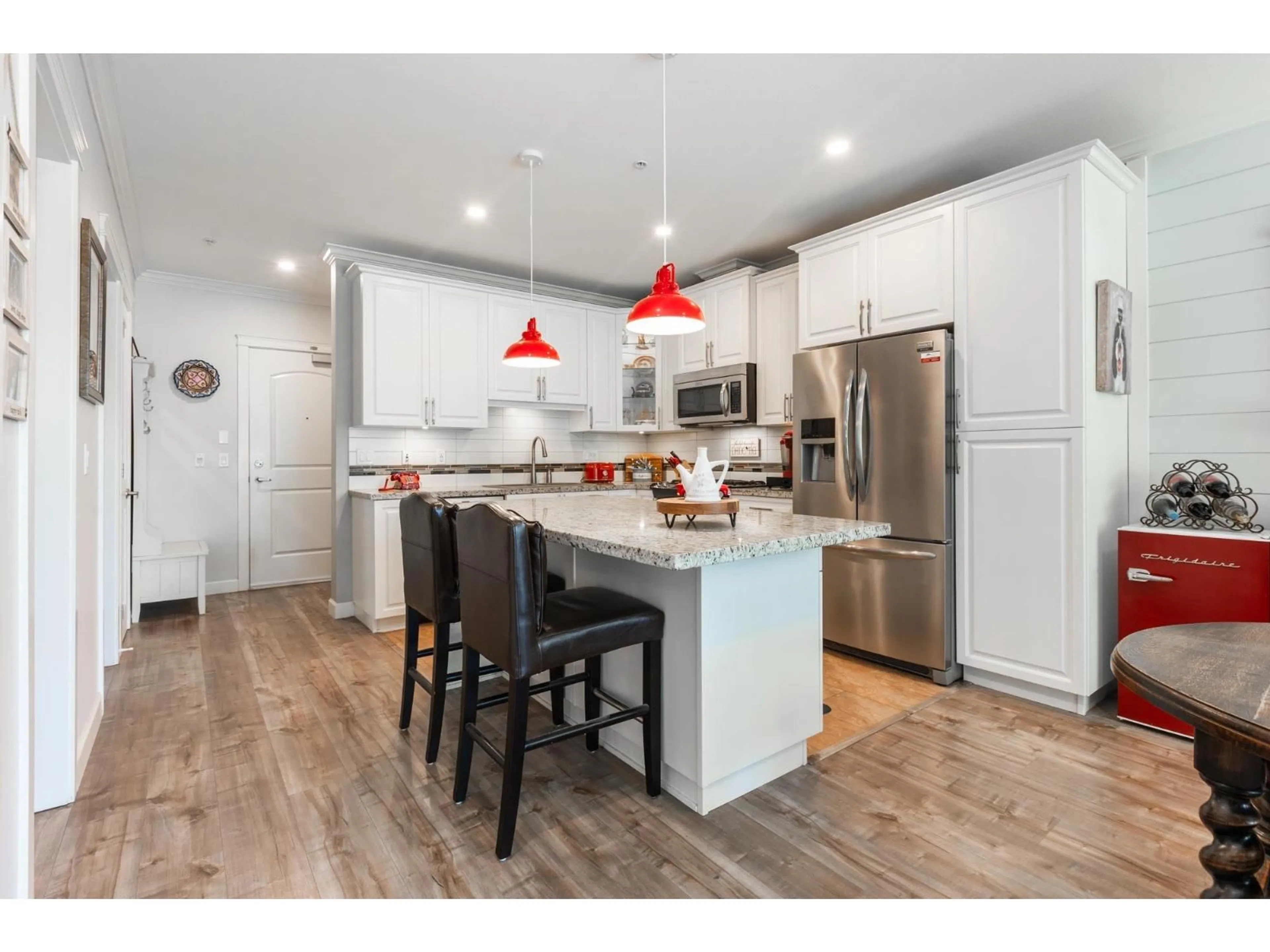 Open concept kitchen, wood/laminate floor for 112 - 8067 207 STREET, Langley British Columbia V2Y0N9