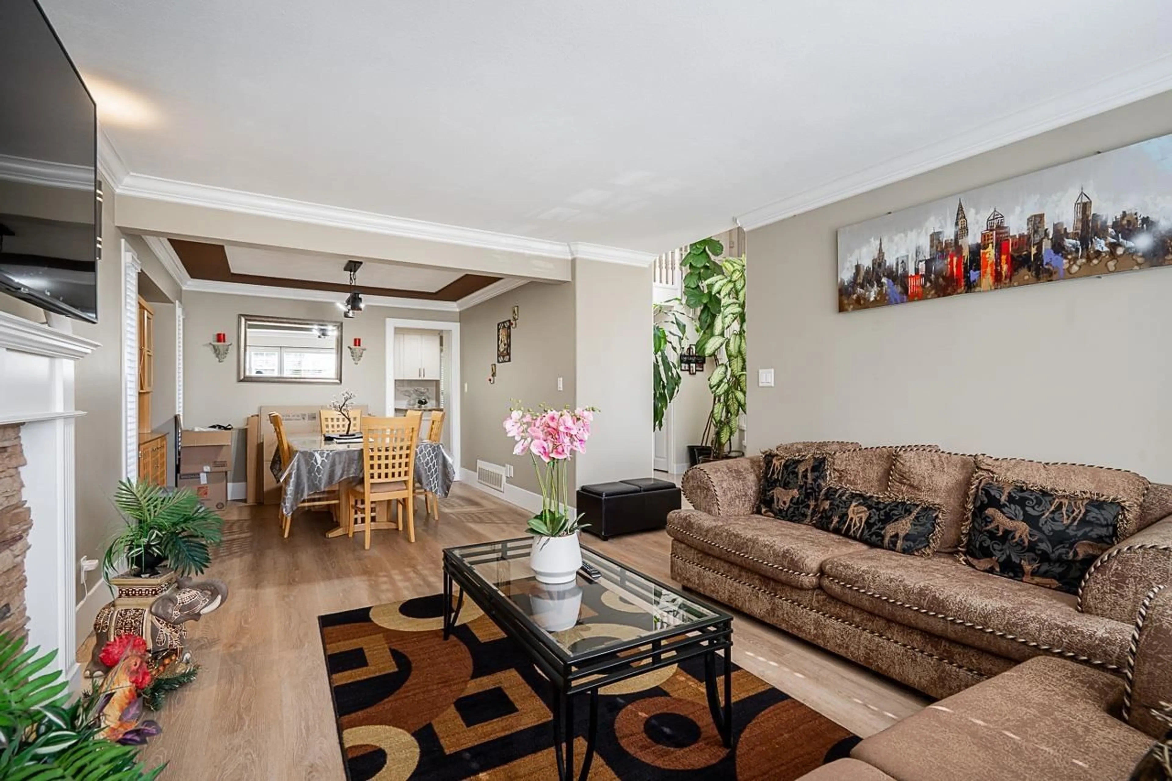 Living room with furniture, wood/laminate floor for 18656 64A AVENUE, Surrey British Columbia V3S8X3