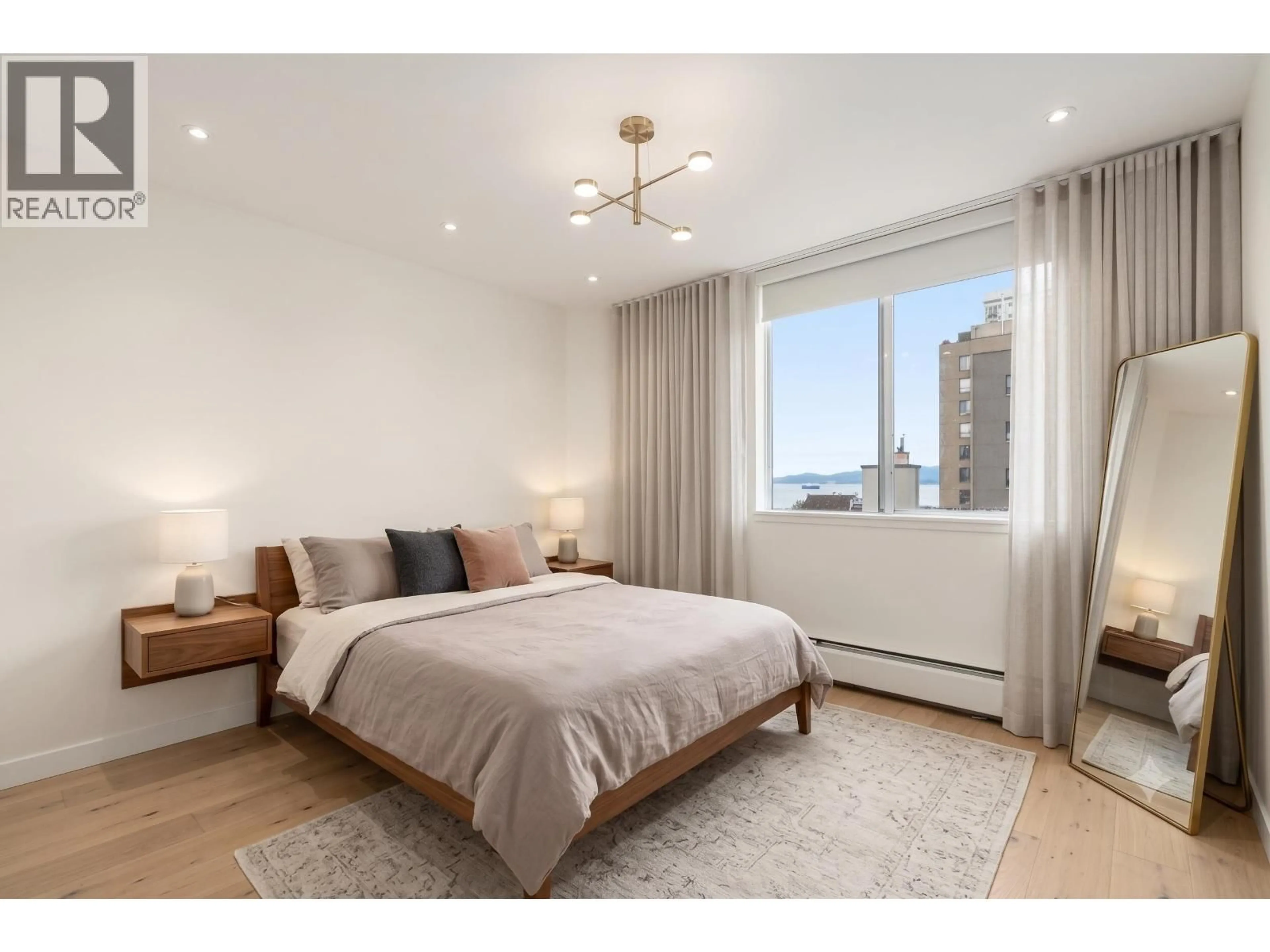 Bedroom with bed, wood/laminate floor for 1004 - 1251 CARDERO STREET, Vancouver British Columbia V6G2H9