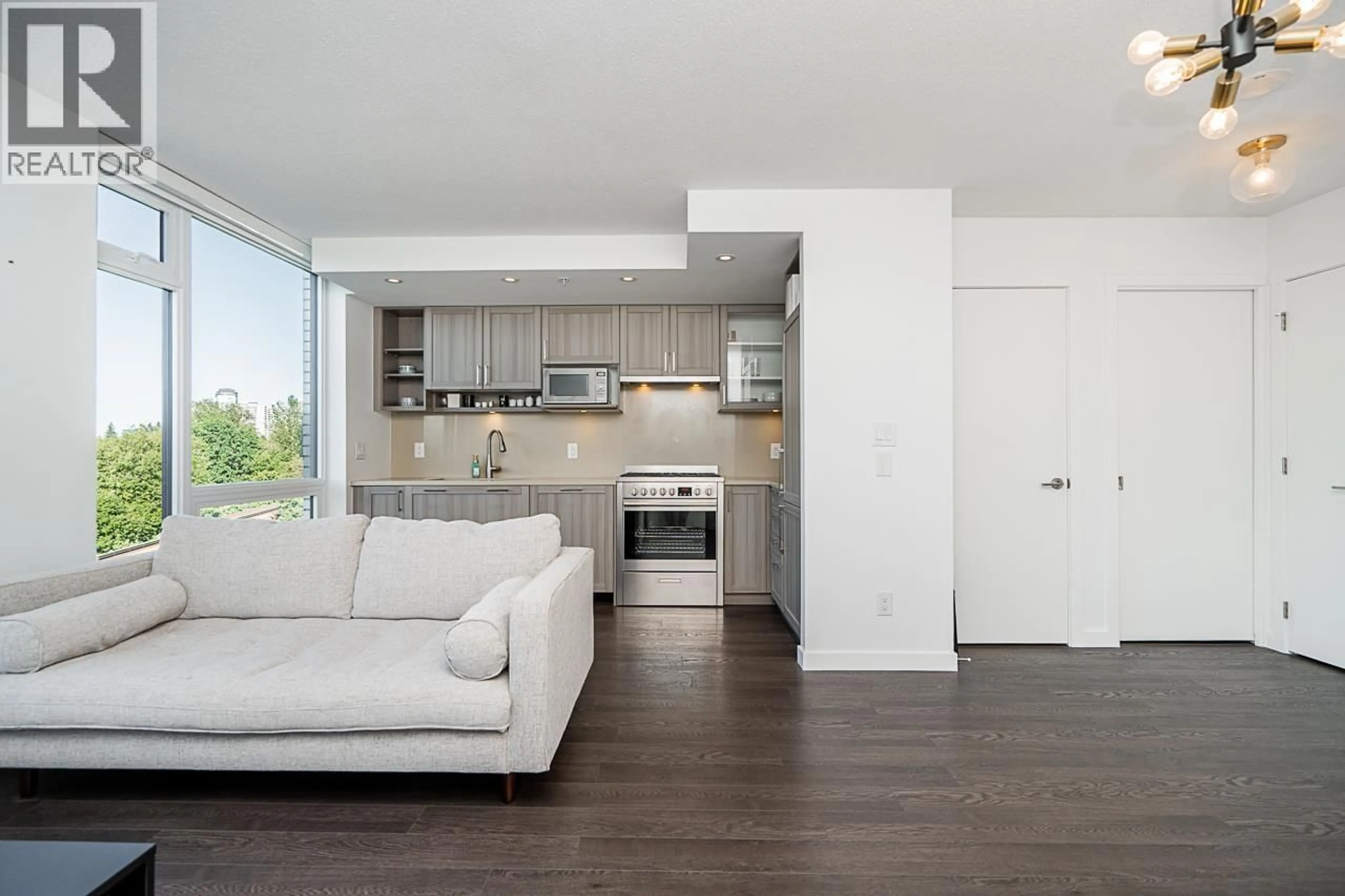 Living room with furniture, wood/laminate floor for 1006 - 5470 ORMIDALE STREET, Vancouver British Columbia V5R0G6