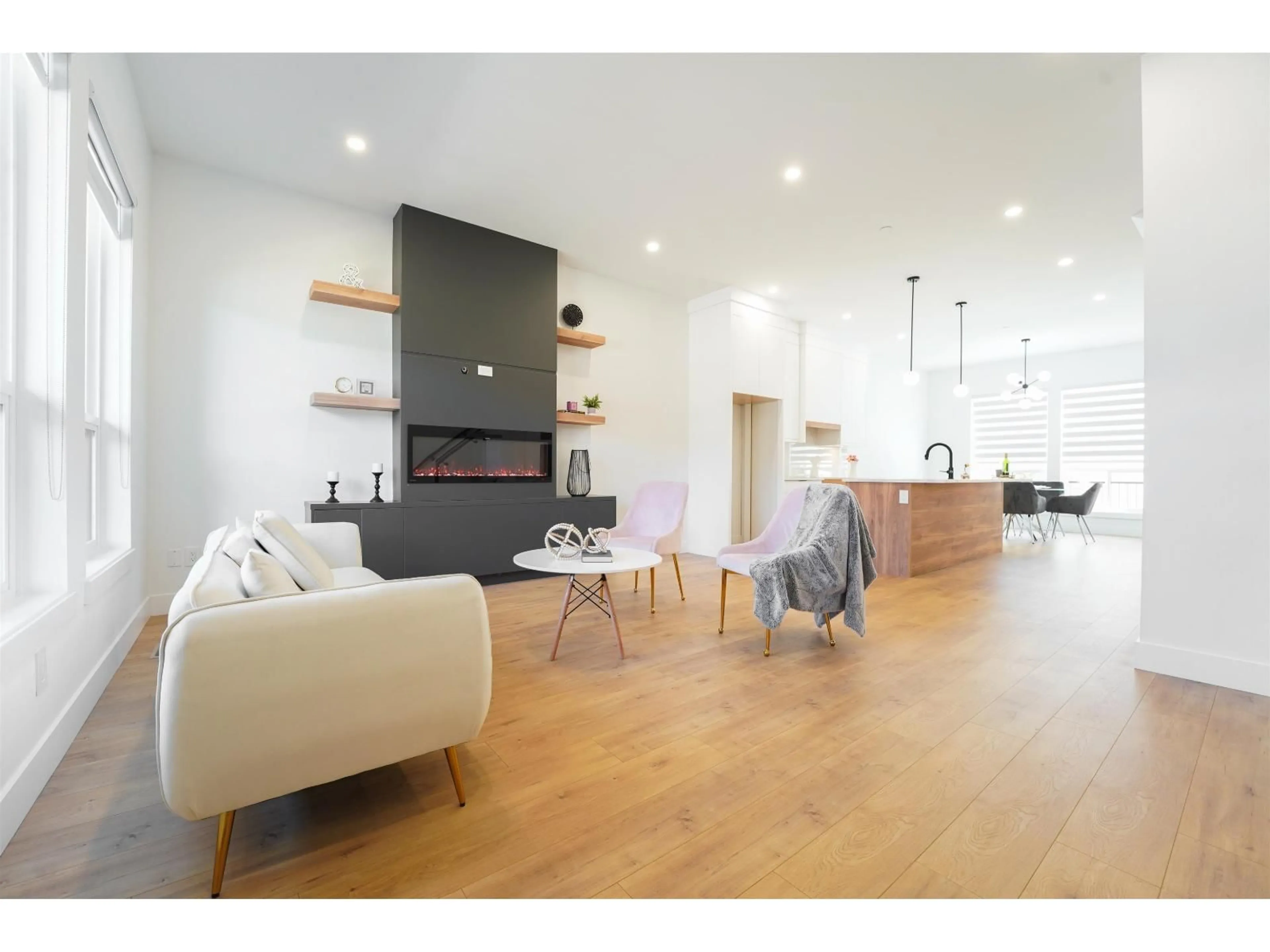 Living room with furniture, wood/laminate floor for 20482 76 AVENUE, Langley British Columbia V3S2H2
