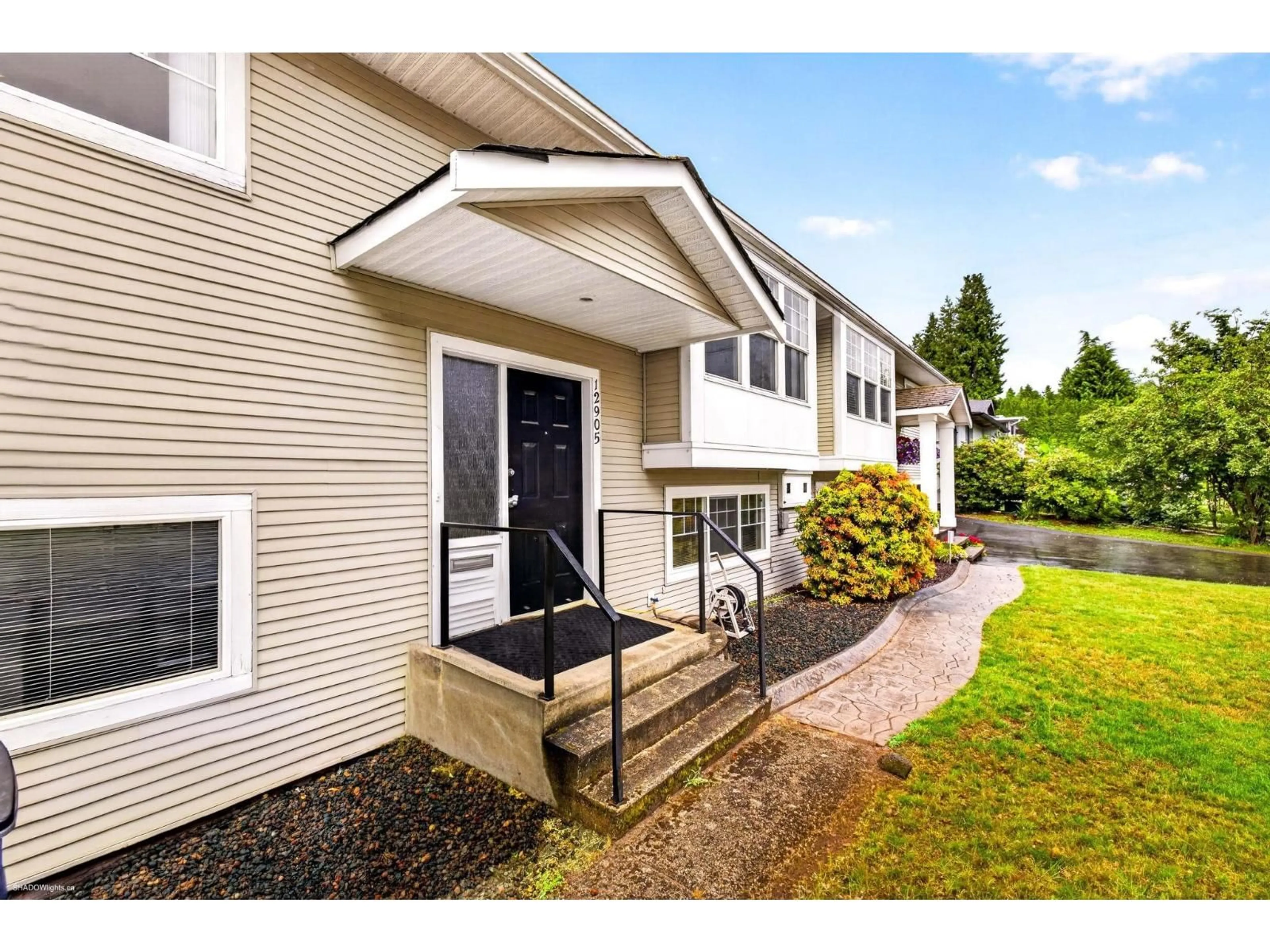 Home with vinyl exterior material, street for 12905 99 AVENUE, Surrey British Columbia V3T1E6