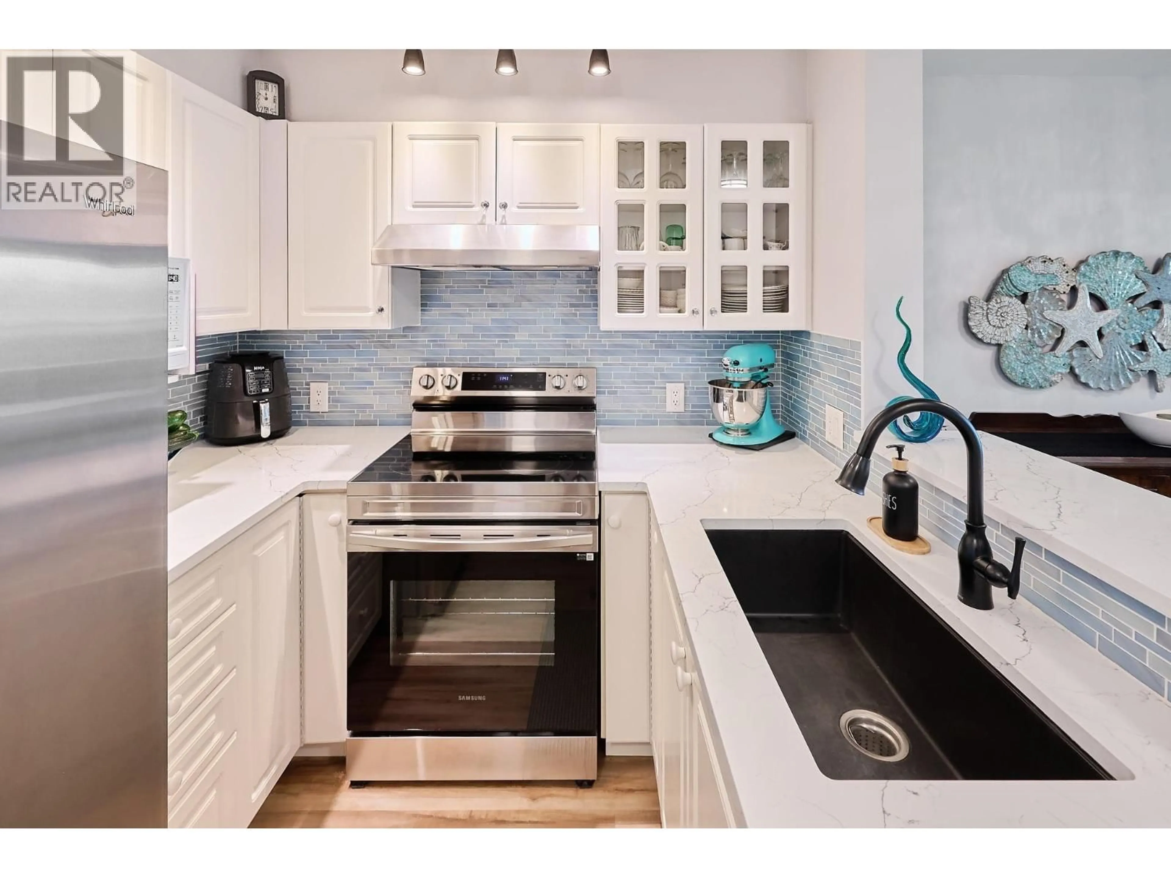 Contemporary kitchen, ceramic/tile floor for 305 - 155 3RD STREET, North Vancouver British Columbia V7L1E5