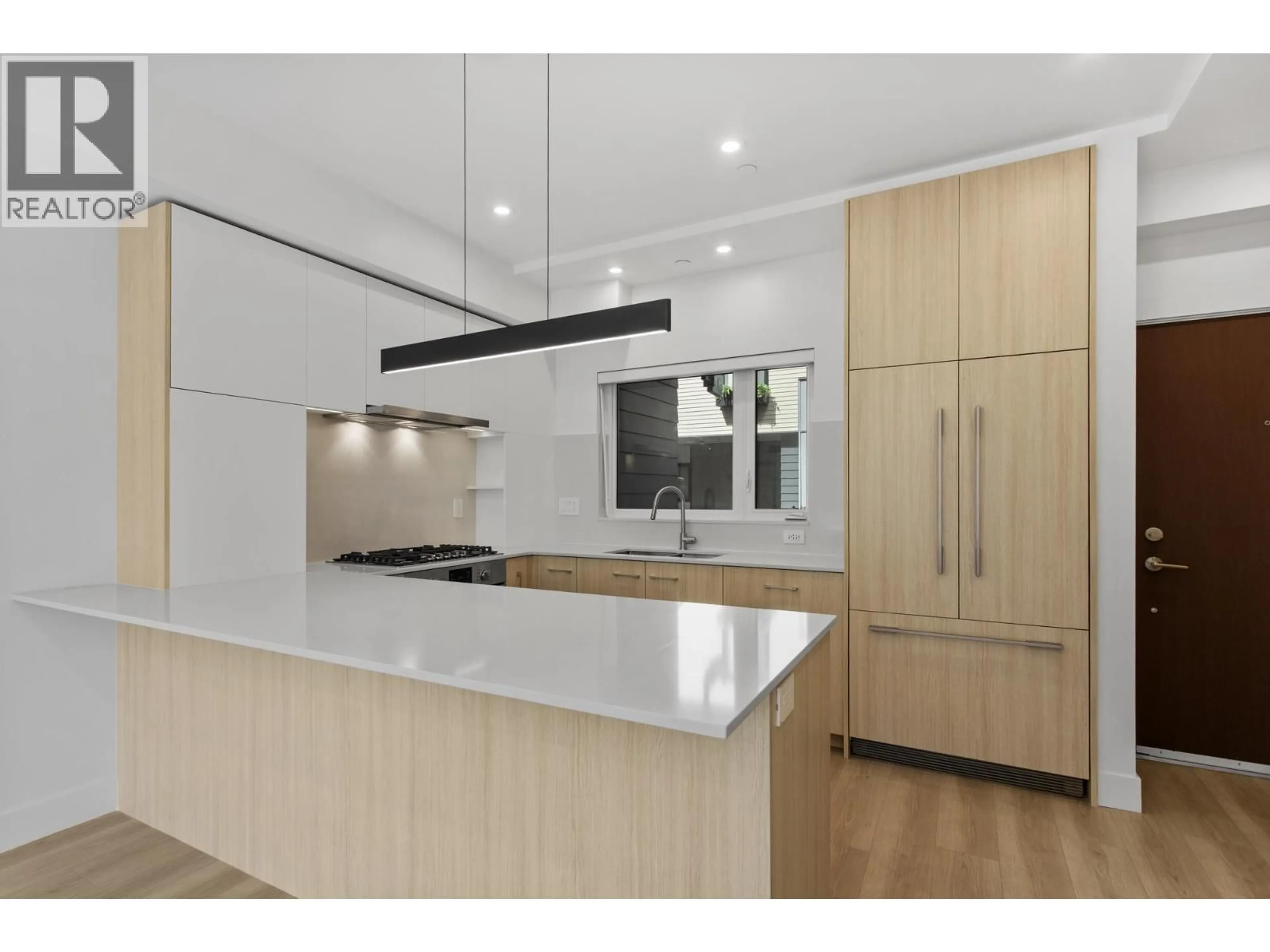 Contemporary kitchen, wood/laminate floor for 111 - 342 MOUNTAIN HIGHWAY, North Vancouver British Columbia V7J2K8