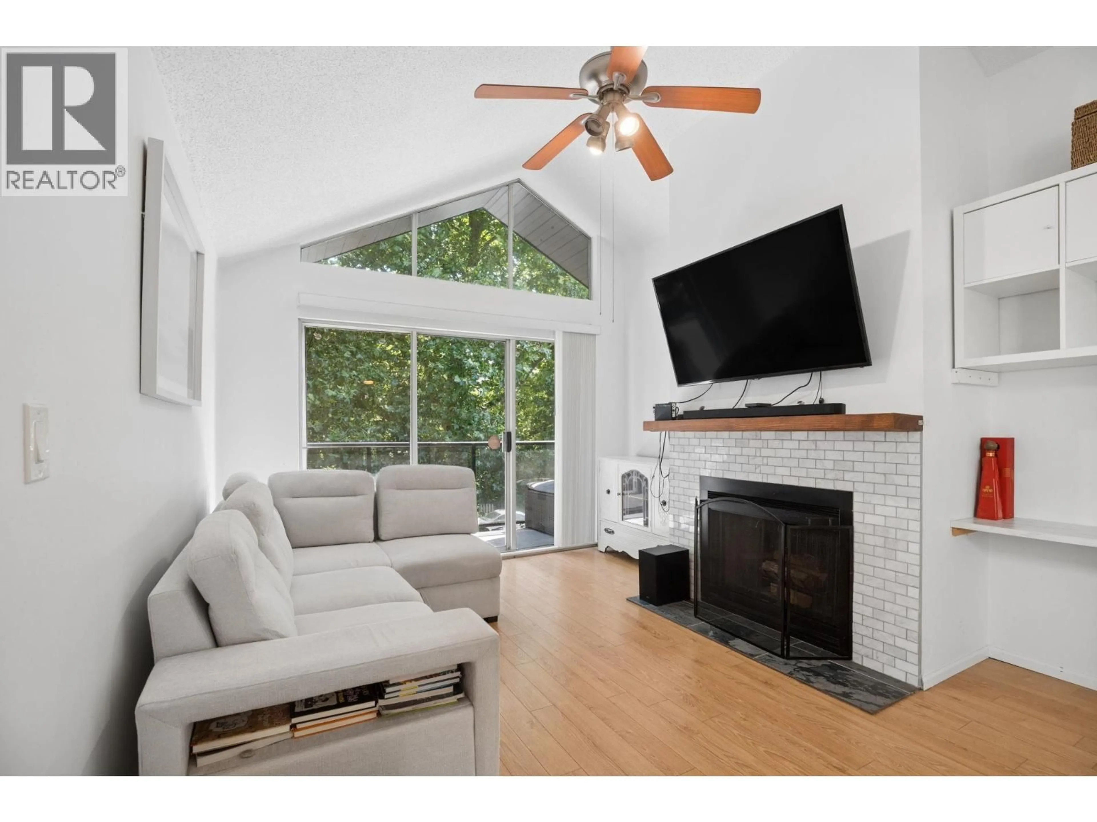 Living room with furniture, wood/laminate floor for 303 - 230 MOWAT STREET, New Westminster British Columbia V3M4B2