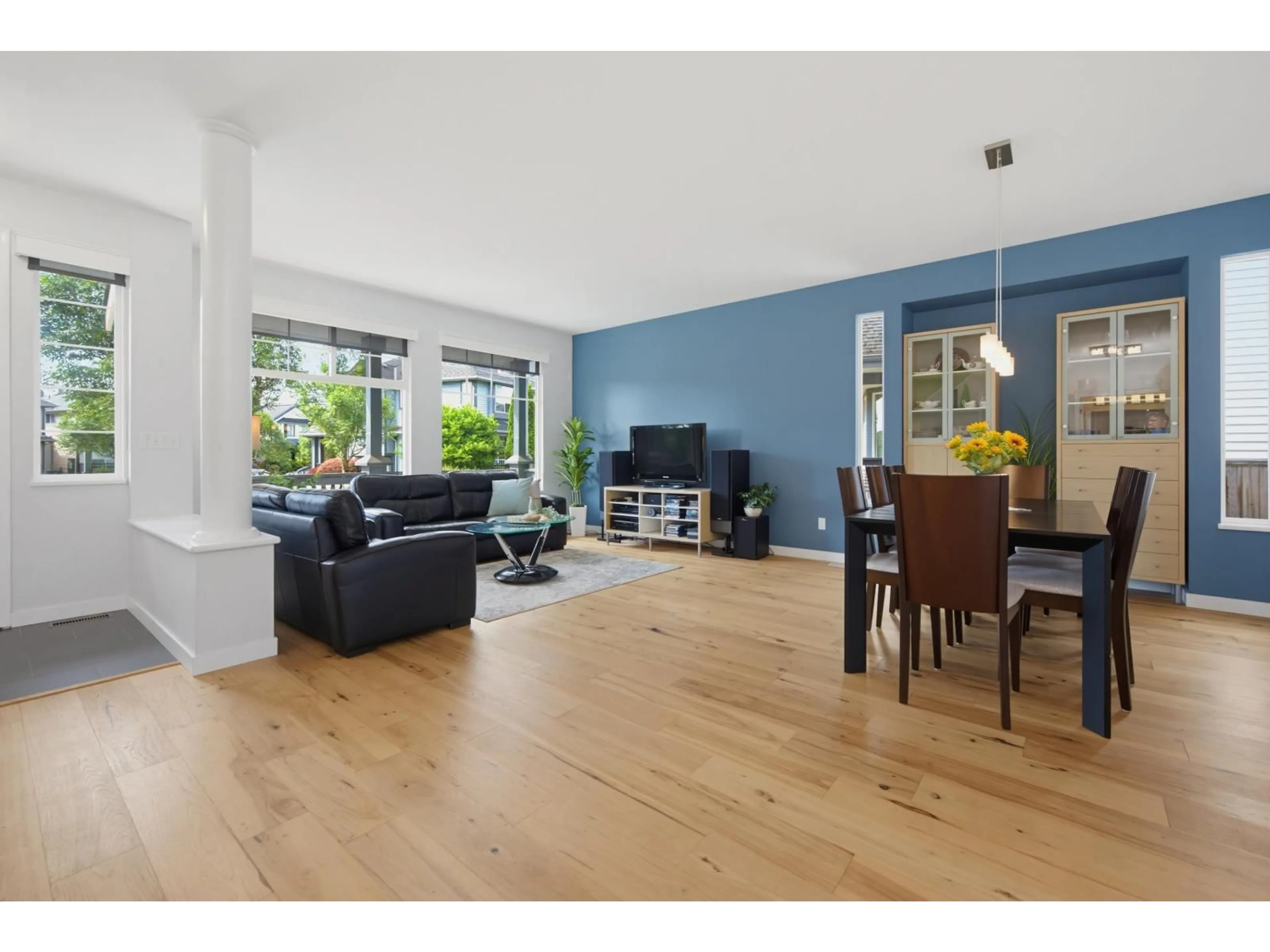 Living room with furniture, wood/laminate floor for 18503 64B AVENUE, Surrey British Columbia V3S8S8