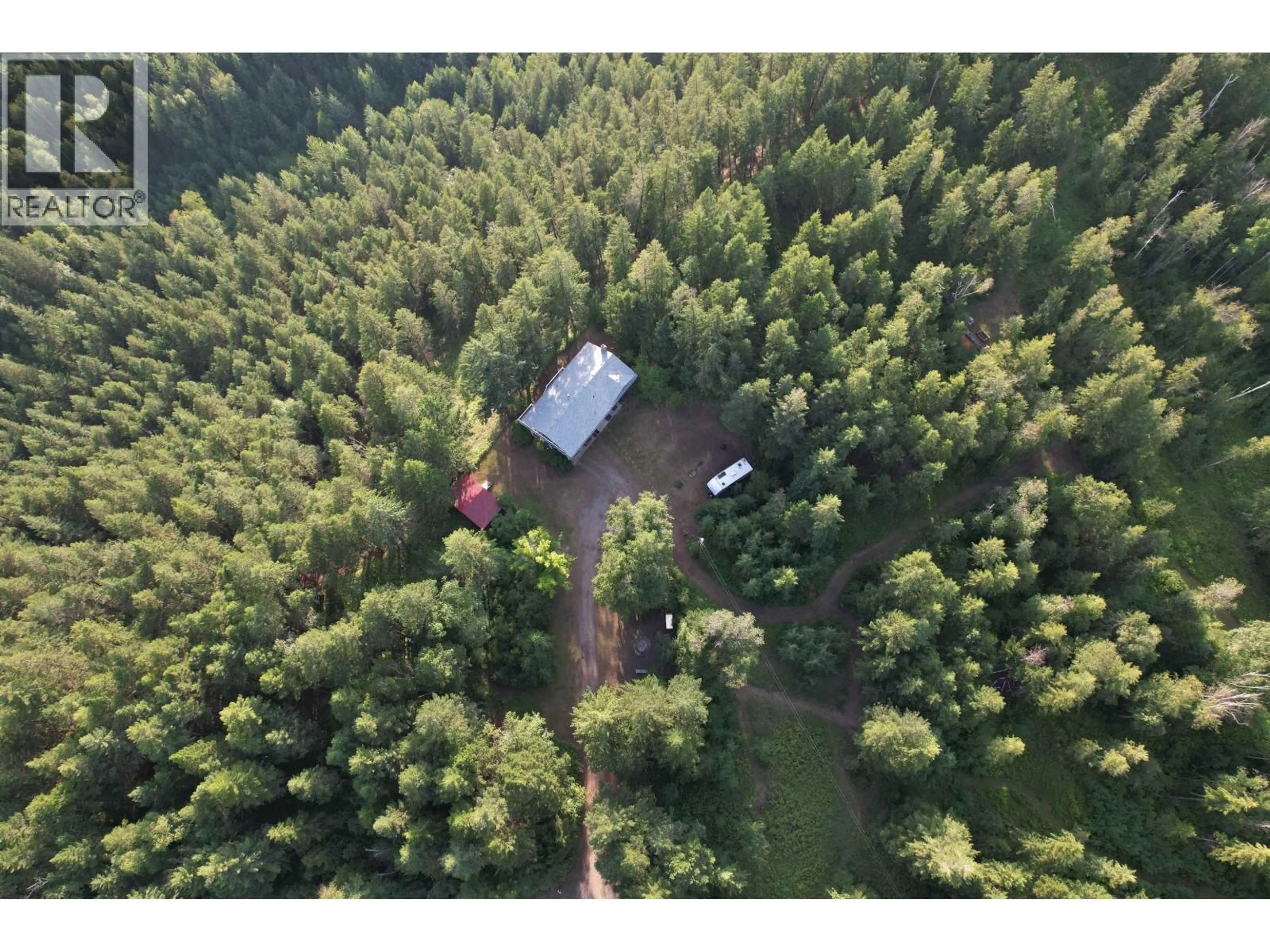 A pic from outside/outdoor area/front of a property/back of a property/a pic from drone, forest/trees view for 2400 ARNOLDUS ROAD, Quesnel British Columbia V2J6L2