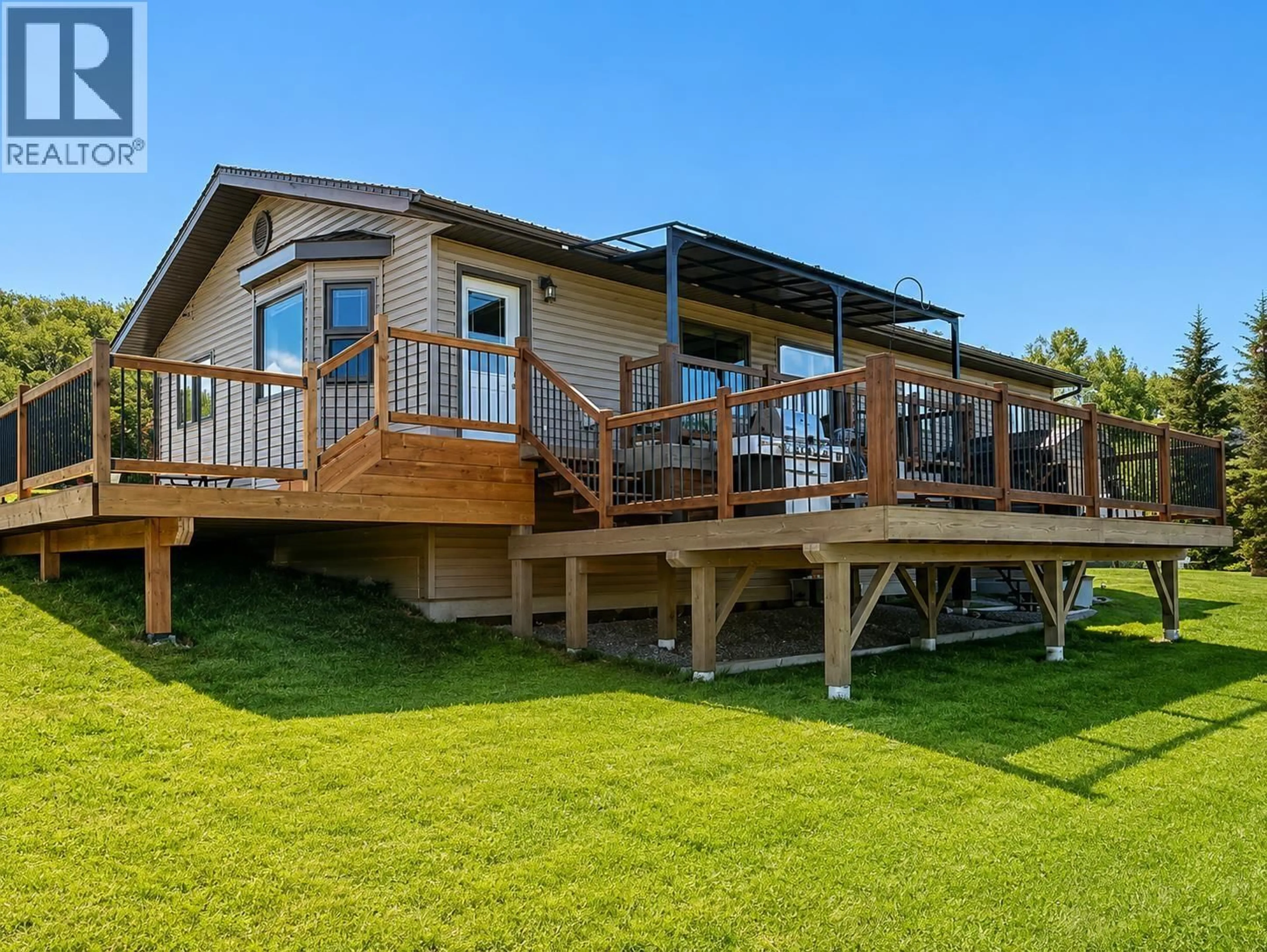 Home with vinyl exterior material, water/lake/river/ocean view for 12713 AITCHISON ROAD, Charlie Lake British Columbia V0C1H0