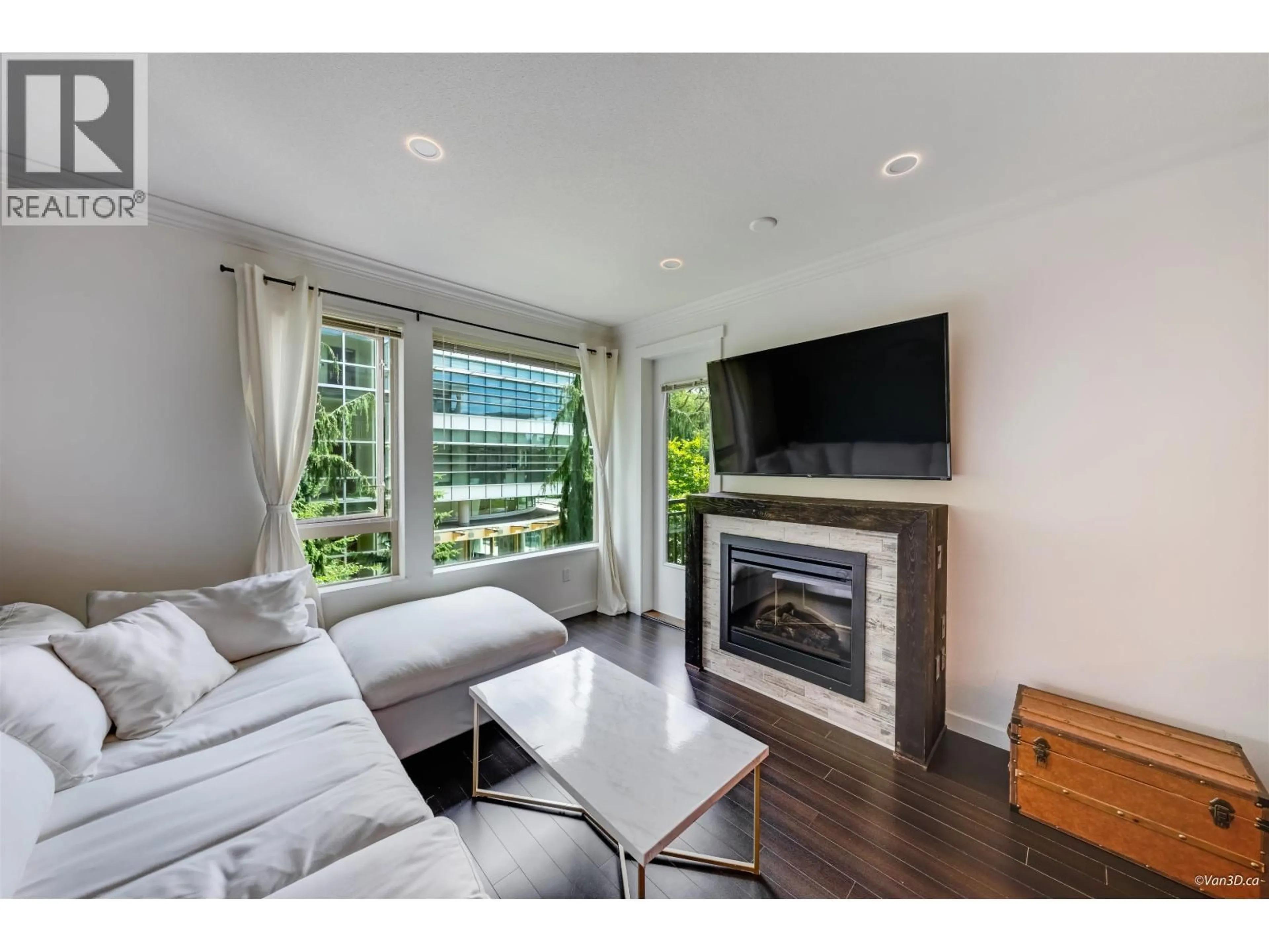 Living room with furniture, wood/laminate floor for 319 - 119 22ND STREET, North Vancouver British Columbia V7M0B4