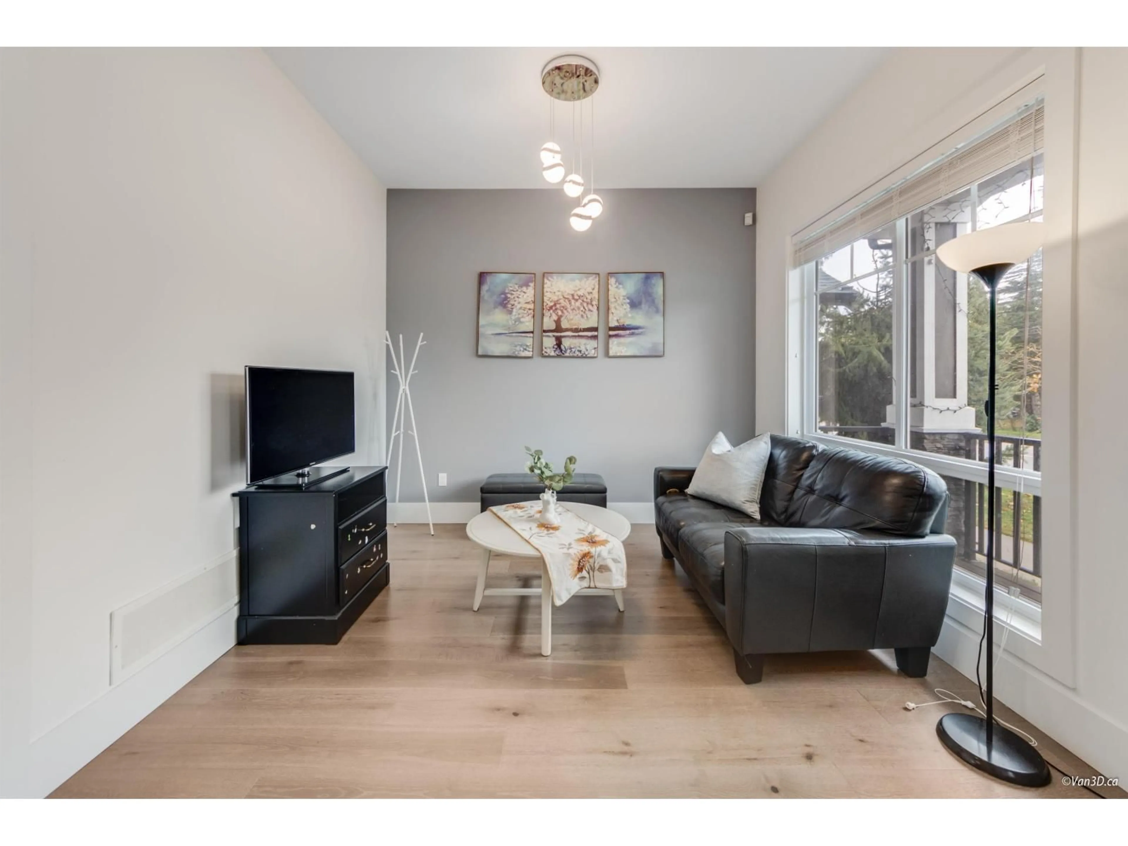 Living room with furniture, wood/laminate floor for 2517 168 STREET, Surrey British Columbia V3Z0A7