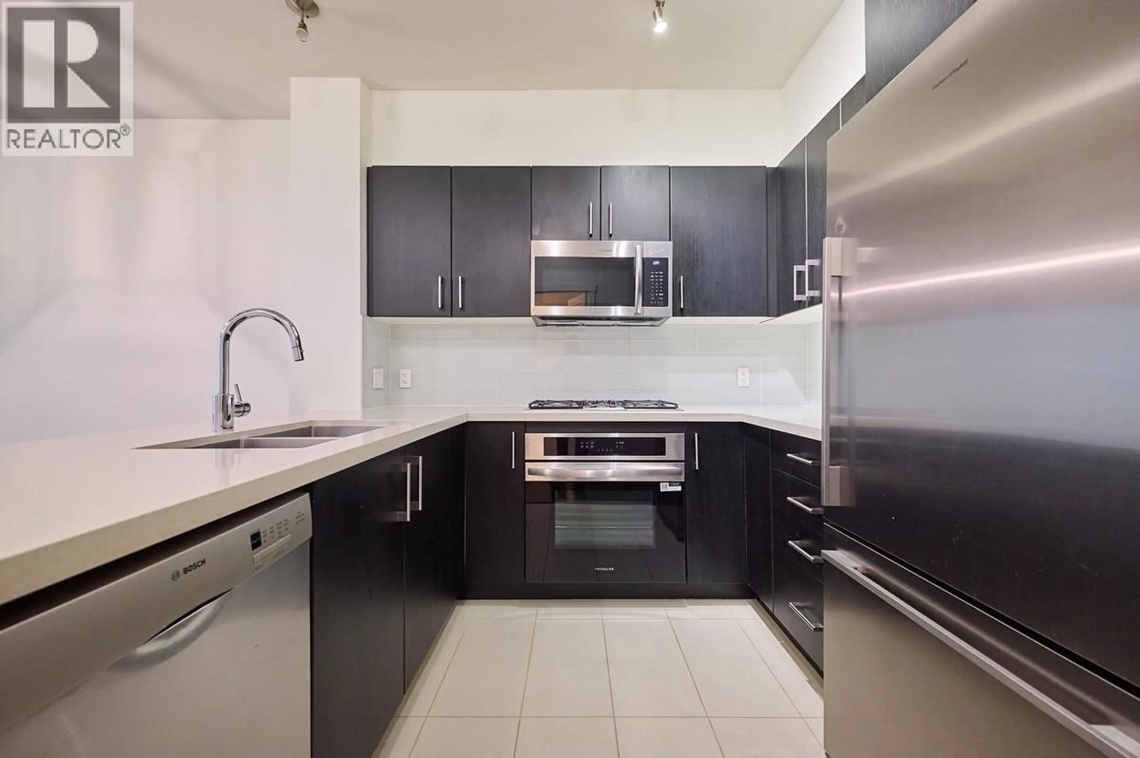 Standard kitchen, ceramic/tile floor for 102 - 3163 RIVERWALK AVENUE, Vancouver British Columbia V5S0A7