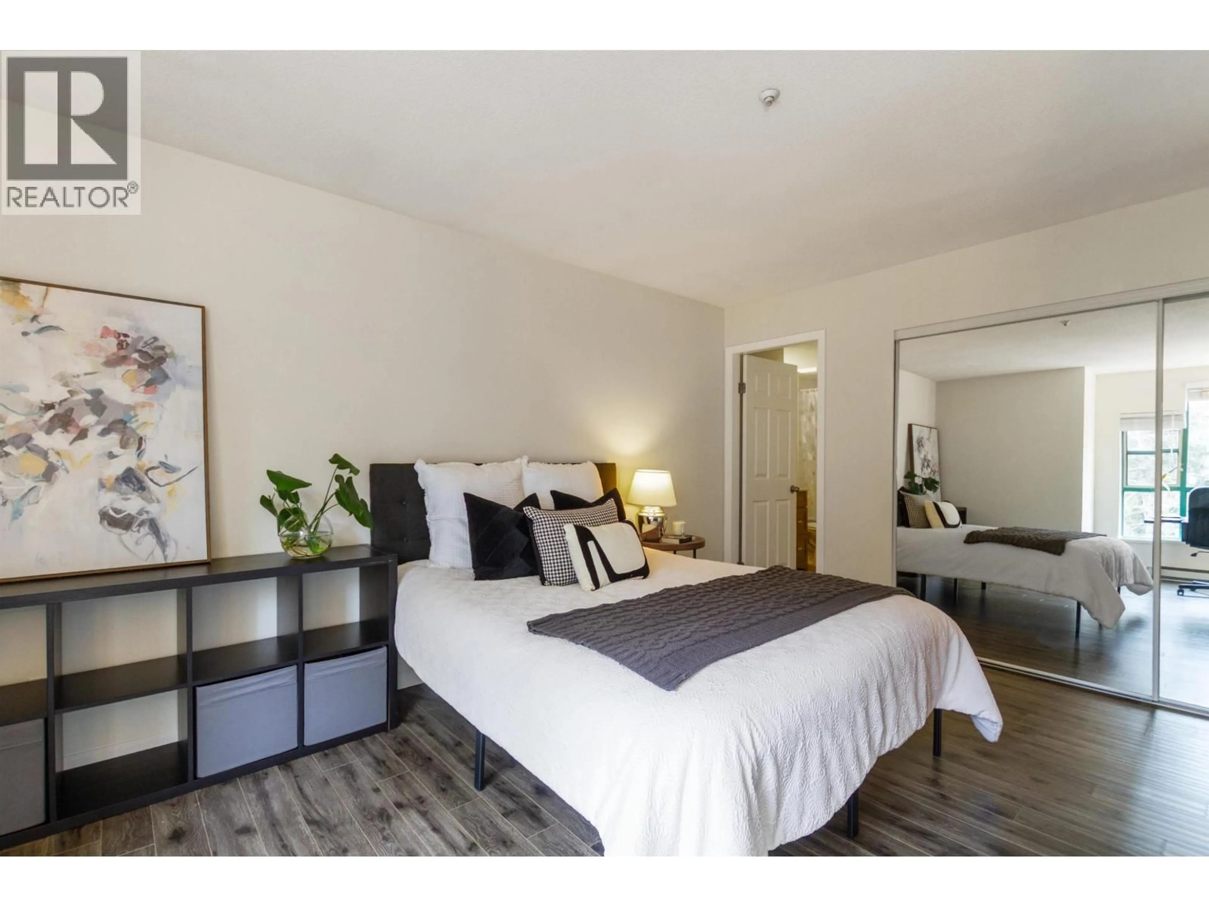 Bedroom with bed, wood/laminate floor for 401E - 3081 GLEN DRIVE, Coquitlam British Columbia V3B2P8