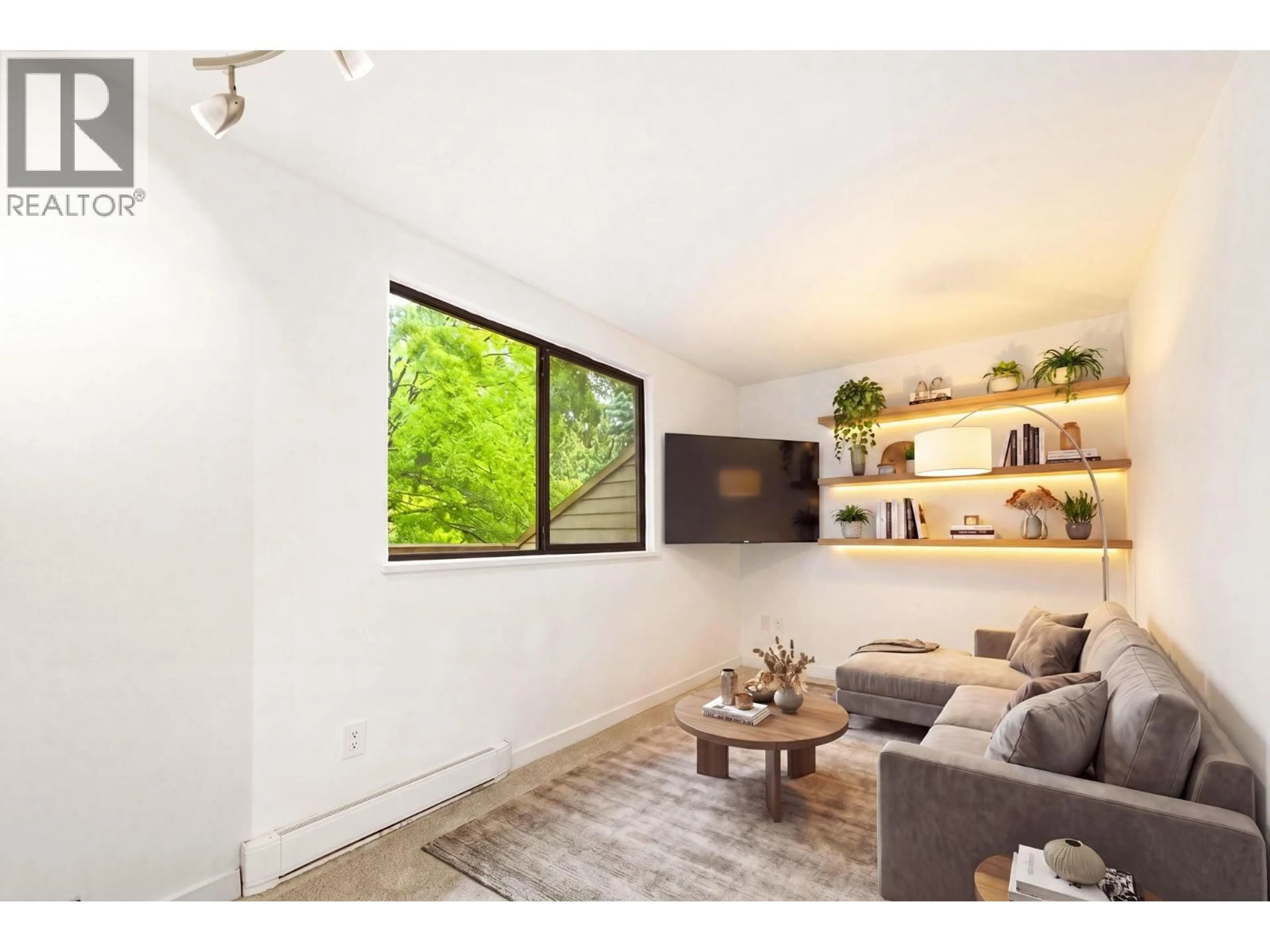 Living room with furniture, wood/laminate floor for 201 - 9132 CAPELLA DRIVE, Burnaby British Columbia V3J7K3