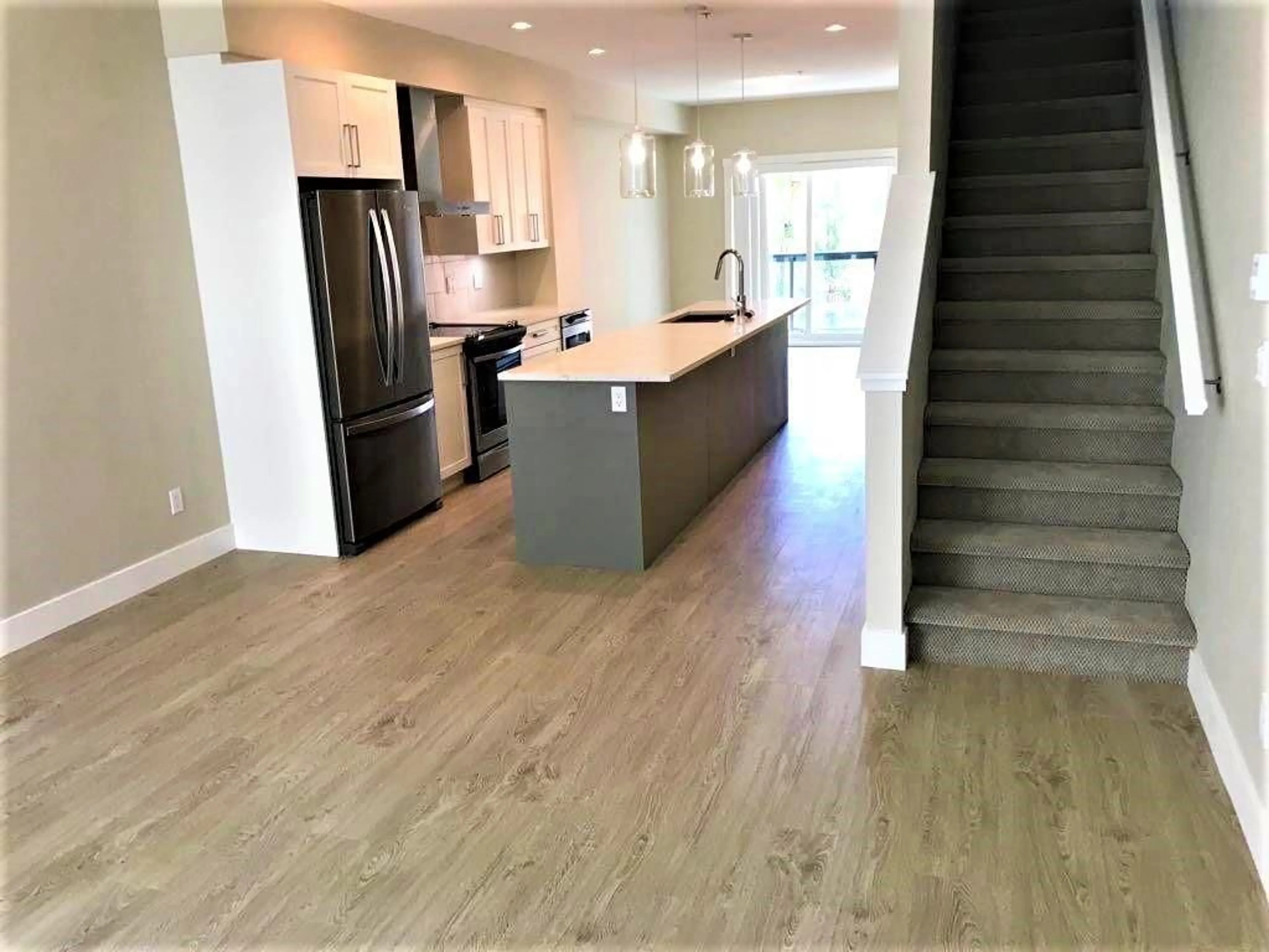 Open concept kitchen, wood/laminate floor for 46 - 20498 82 AVENUE, Langley British Columbia V2Y0V1