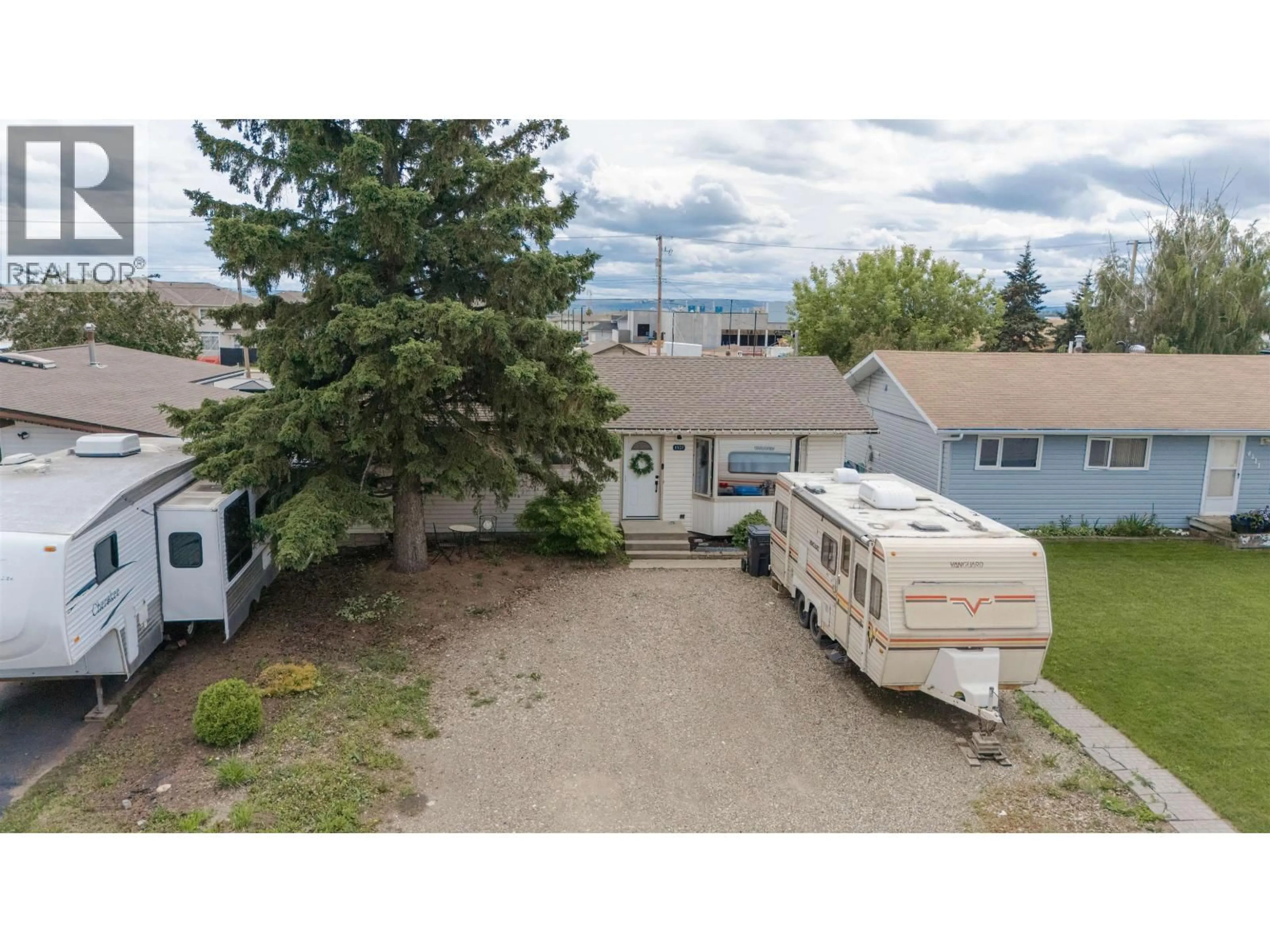 A pic from outside/outdoor area/front of a property/back of a property/a pic from drone, mountain view for 8507 94 AVENUE, Fort St. John British Columbia V1J1E9