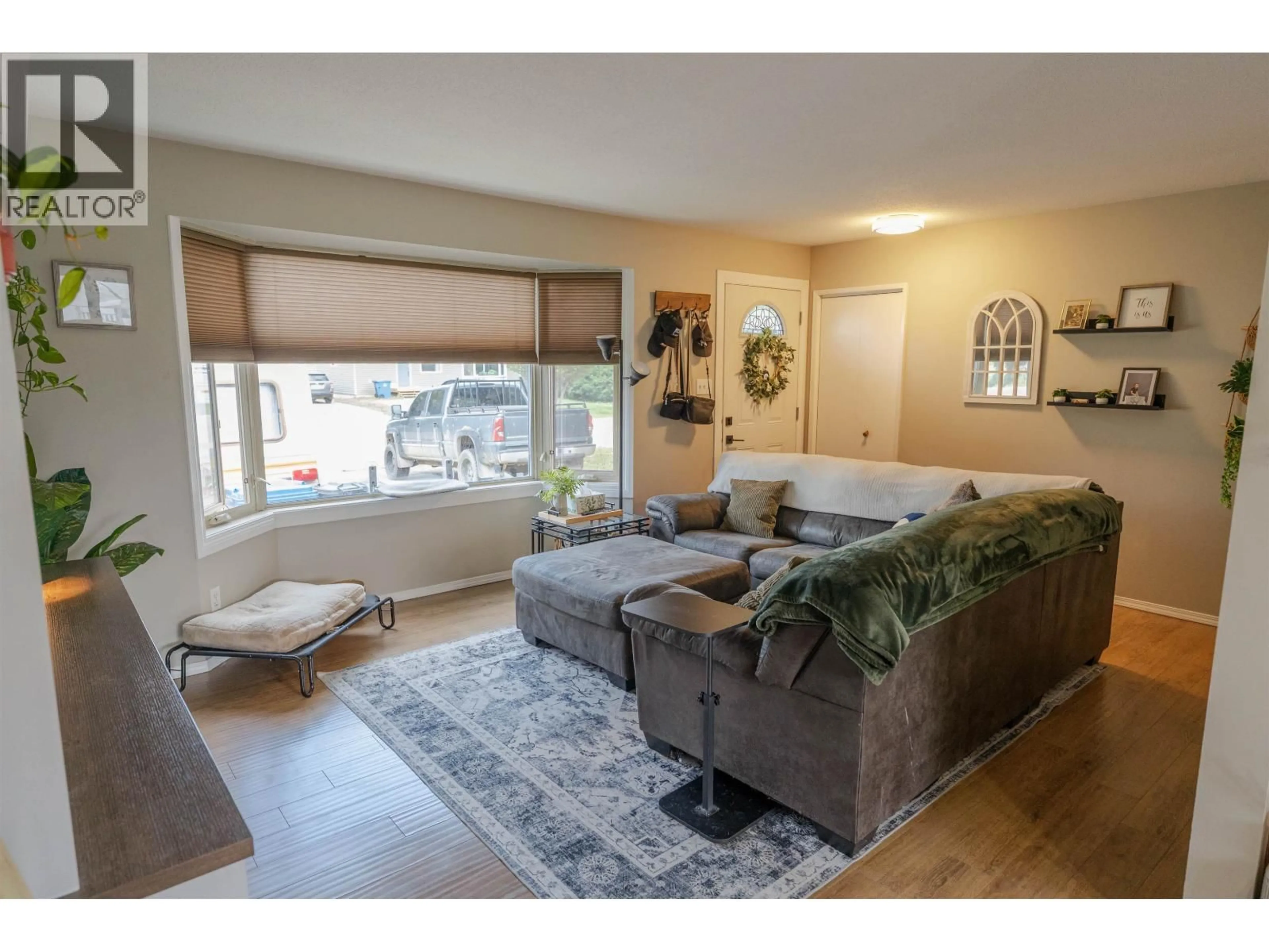 Living room with furniture, unknown for 8507 94 AVENUE, Fort St. John British Columbia V1J1E9