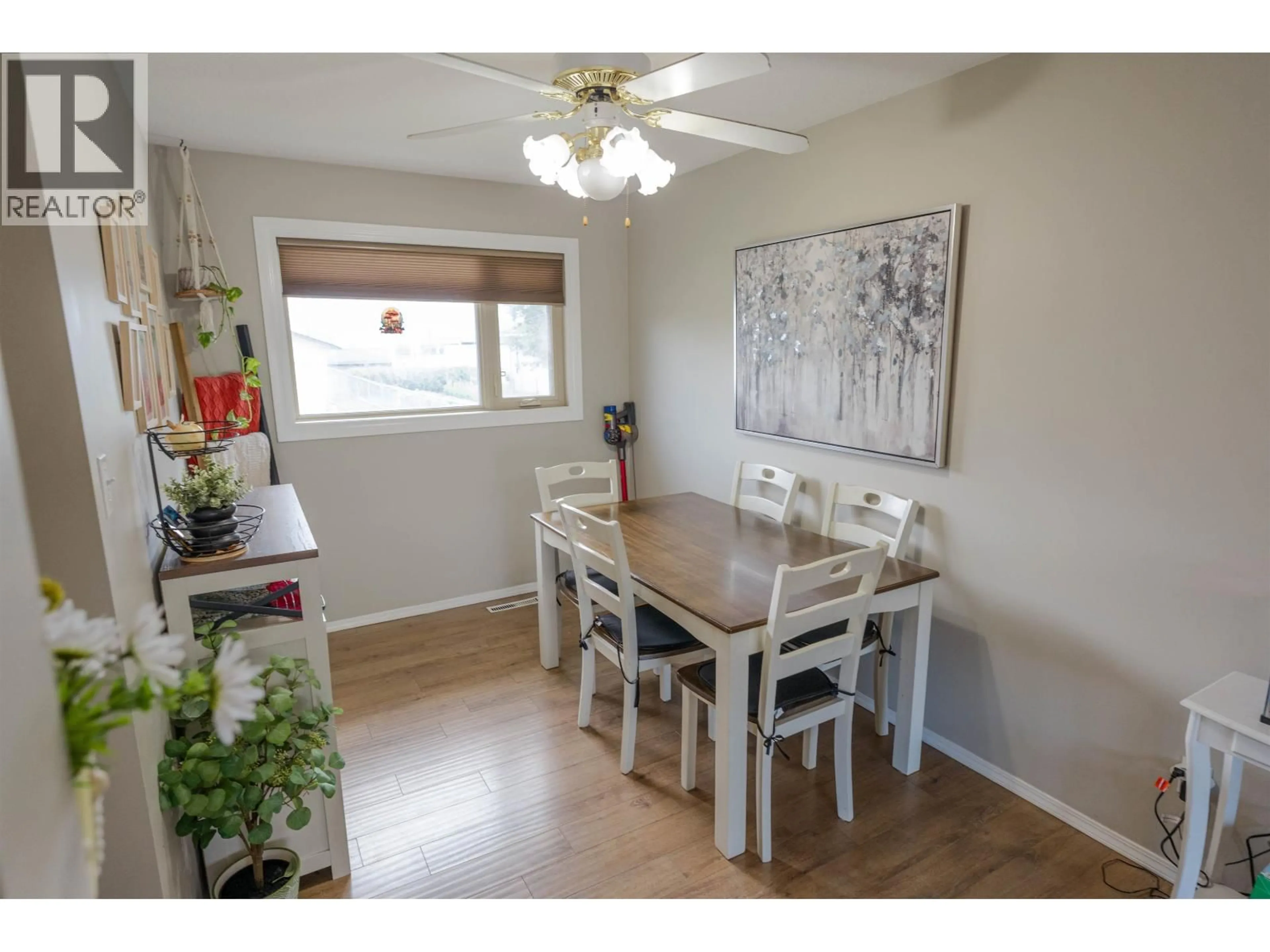 Dining room, wood/laminate floor for 8507 94 AVENUE, Fort St. John British Columbia V1J1E9