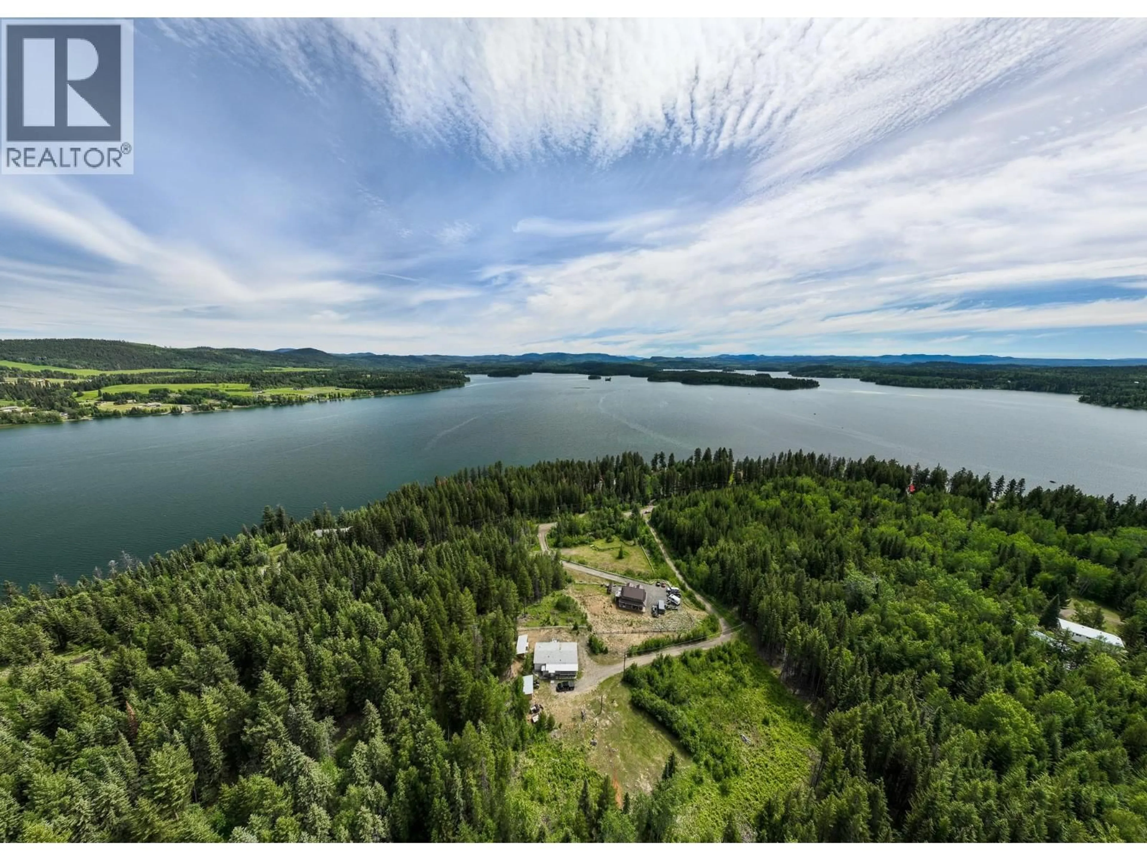 A pic from outside/outdoor area/front of a property/back of a property/a pic from drone, water/lake/river/ocean view for 7384 JOHNSTONE ROAD, Bridge Lake British Columbia V0K1X2