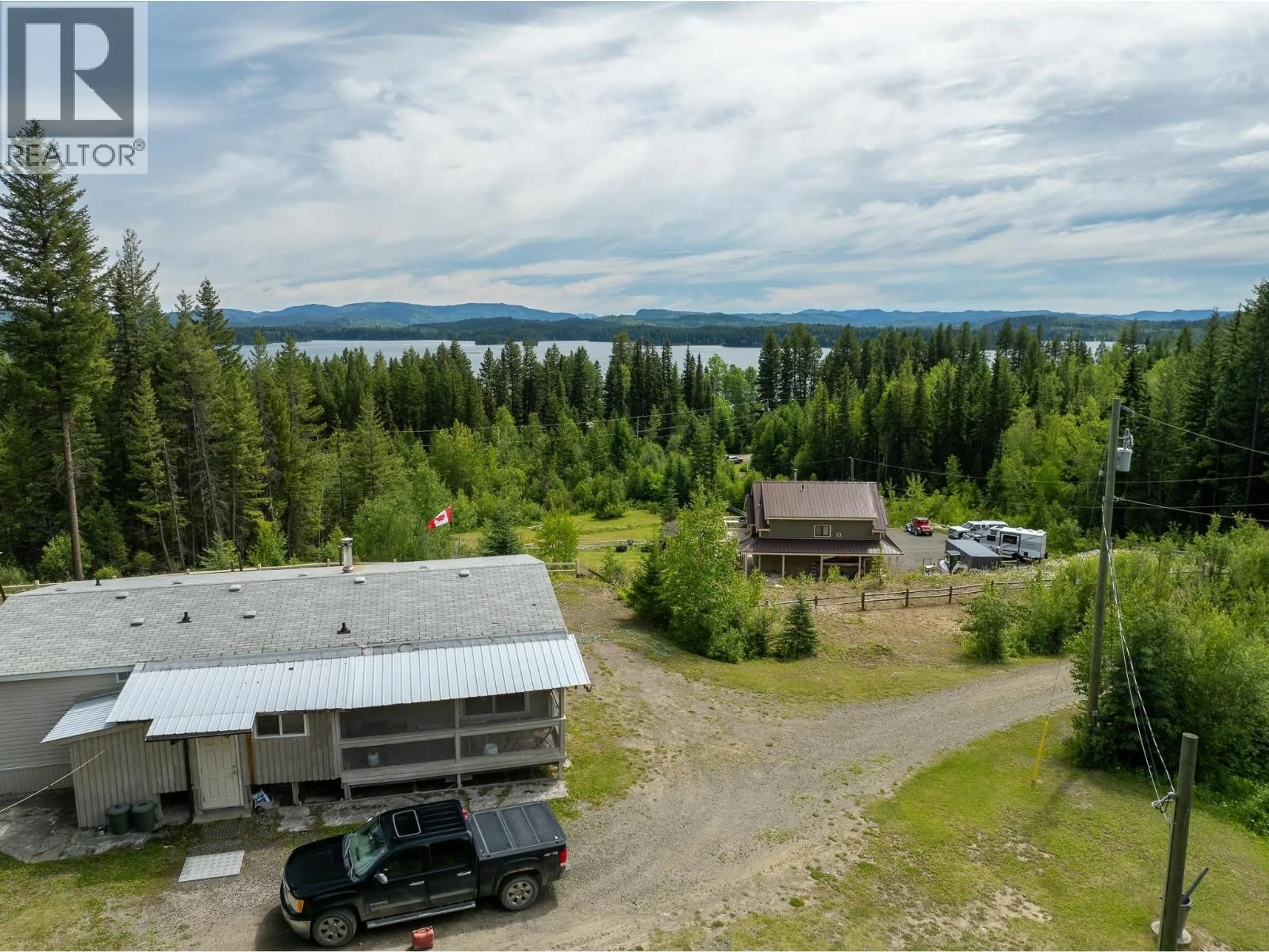 A pic from outside/outdoor area/front of a property/back of a property/a pic from drone, water/lake/river/ocean view for 7384 JOHNSTONE ROAD, Bridge Lake British Columbia V0K1X2