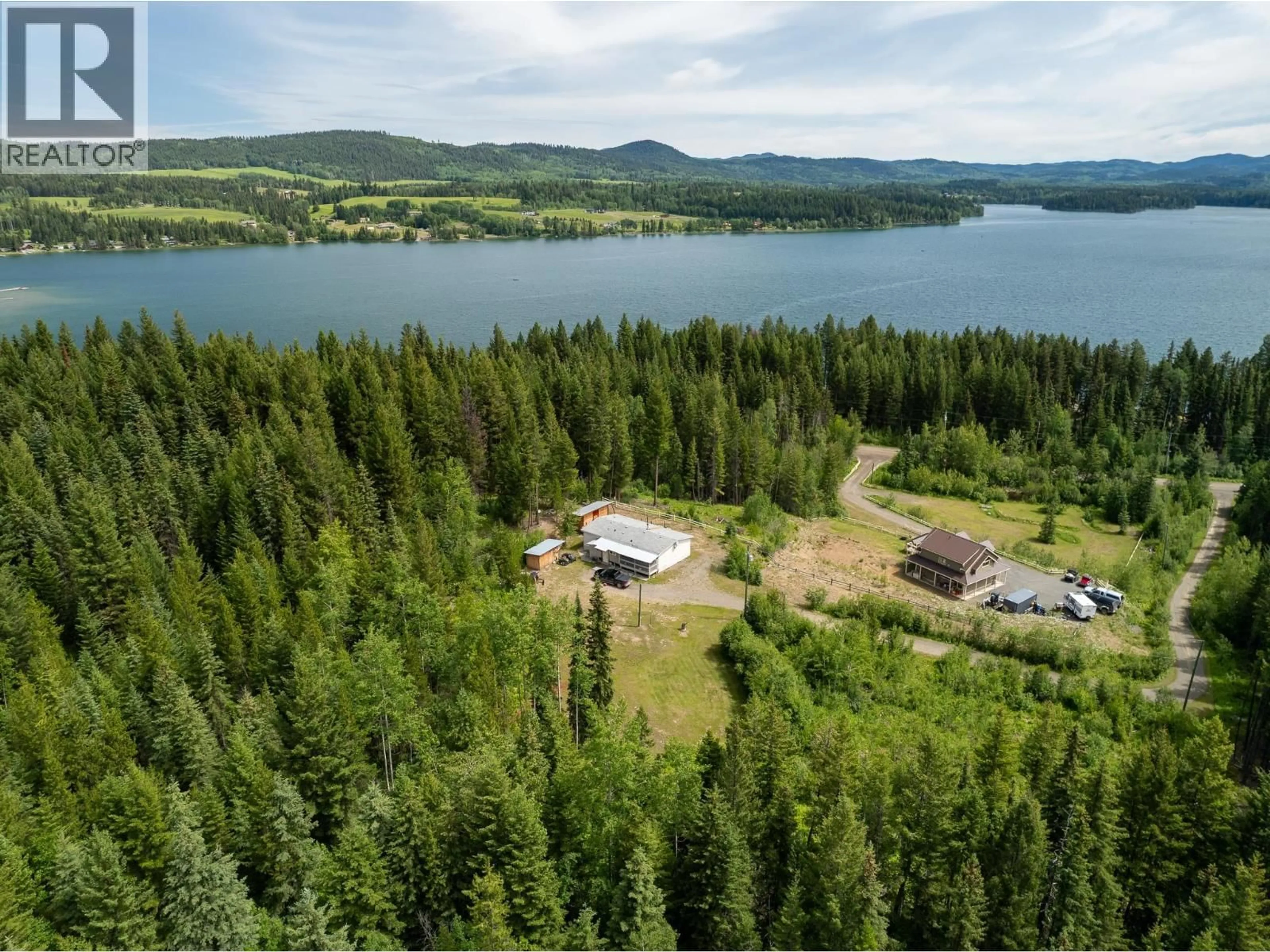 A pic from outside/outdoor area/front of a property/back of a property/a pic from drone, water/lake/river/ocean view for 7384 JOHNSTONE ROAD, Bridge Lake British Columbia V0K1X2