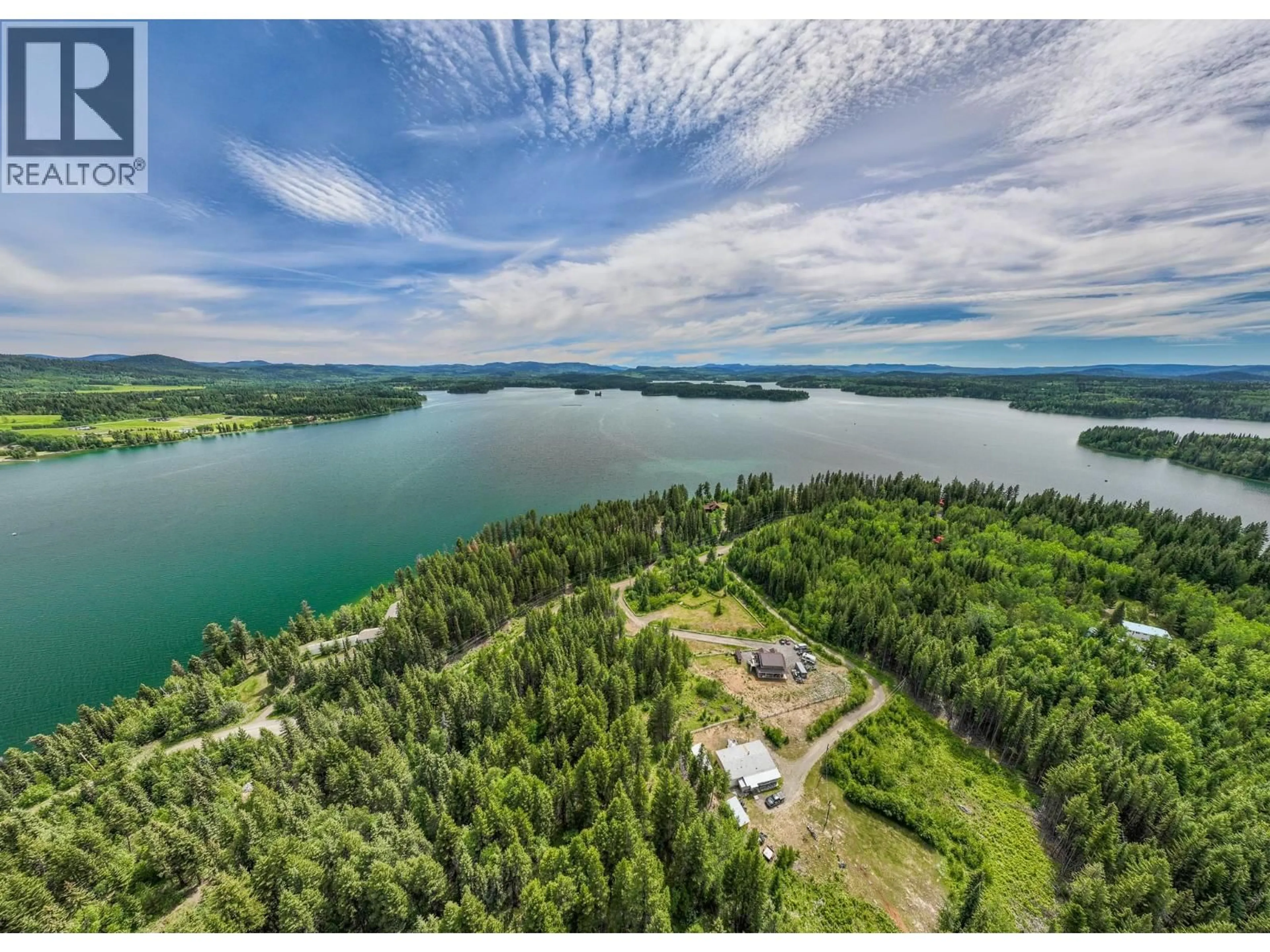 A pic from outside/outdoor area/front of a property/back of a property/a pic from drone, water/lake/river/ocean view for 7384 JOHNSTONE ROAD, Bridge Lake British Columbia V0K1X2
