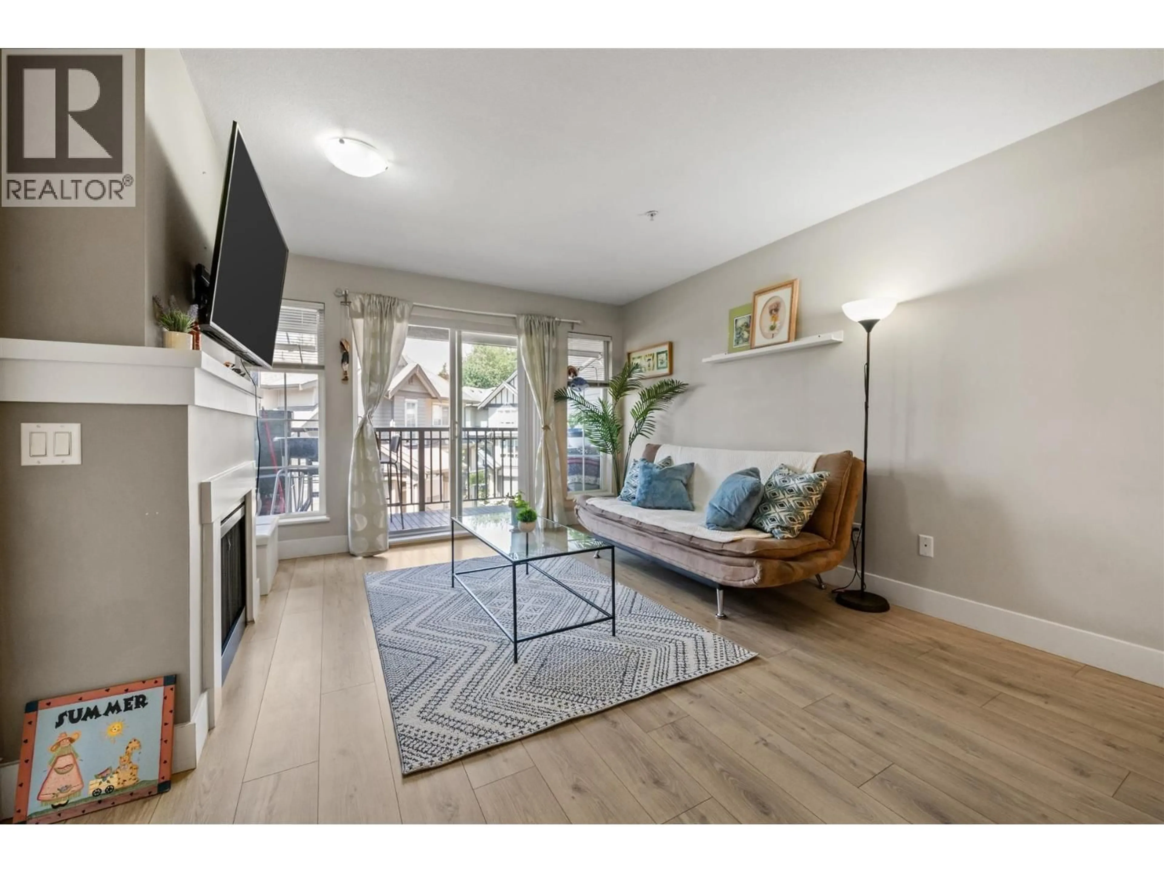 Living room with furniture, wood/laminate floor for 419 - 9098 HALSTON COURT, Burnaby British Columbia V3N0A6