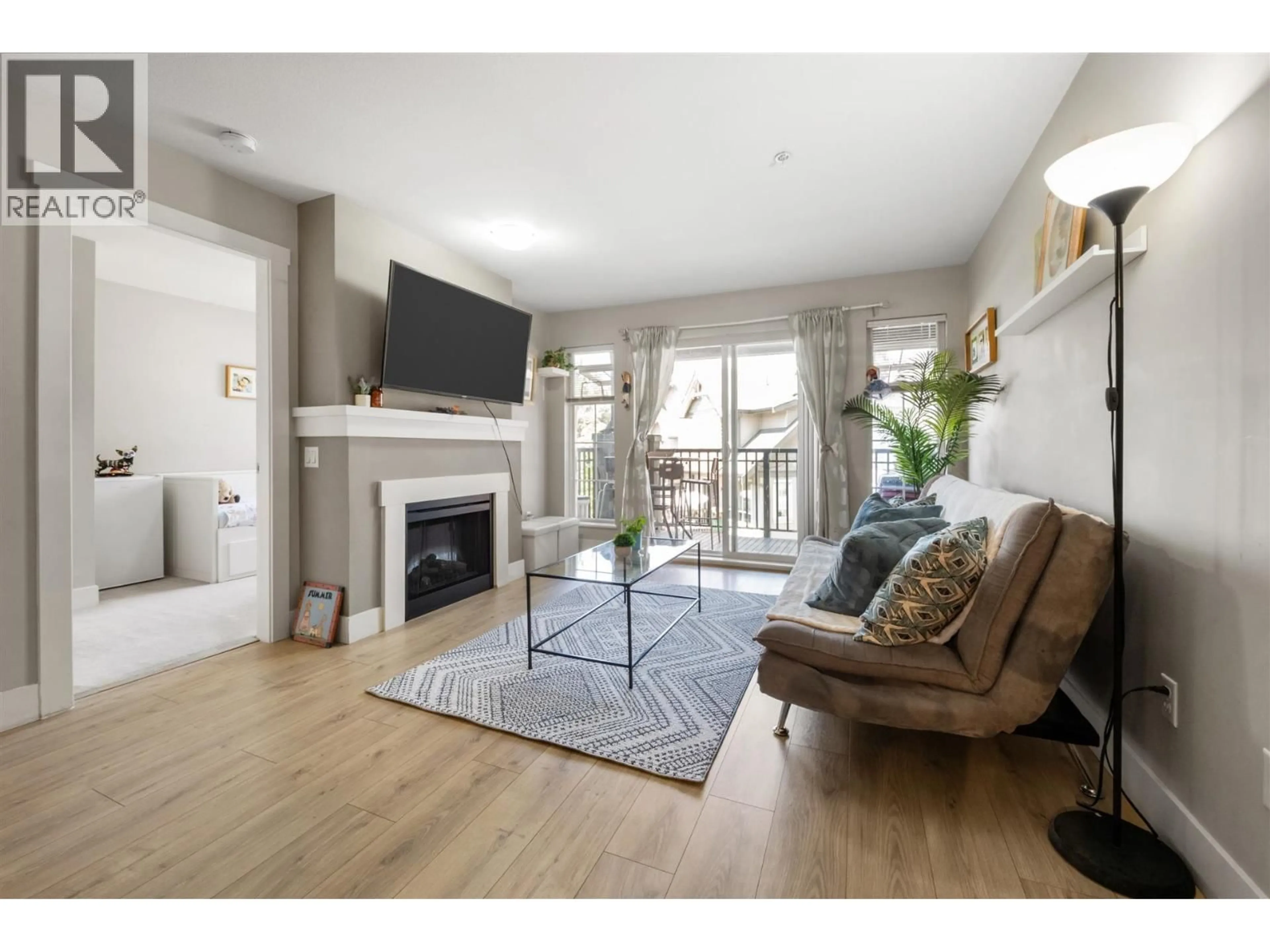Living room with furniture, wood/laminate floor for 419 - 9098 HALSTON COURT, Burnaby British Columbia V3N0A6