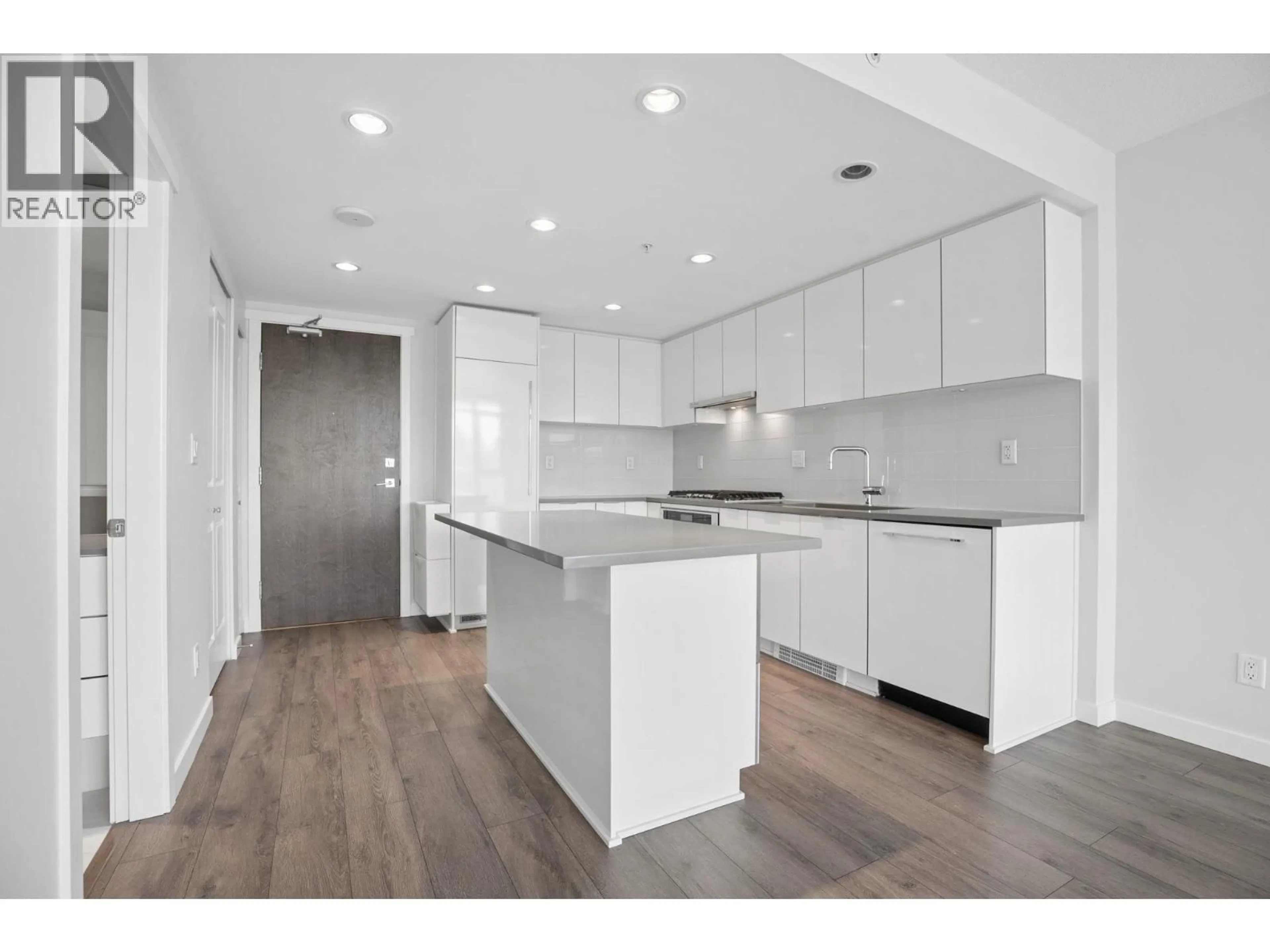 Open concept kitchen, wood/laminate floor for 605 - 2388 MADISON AVENUE, Burnaby British Columbia V5C0K8