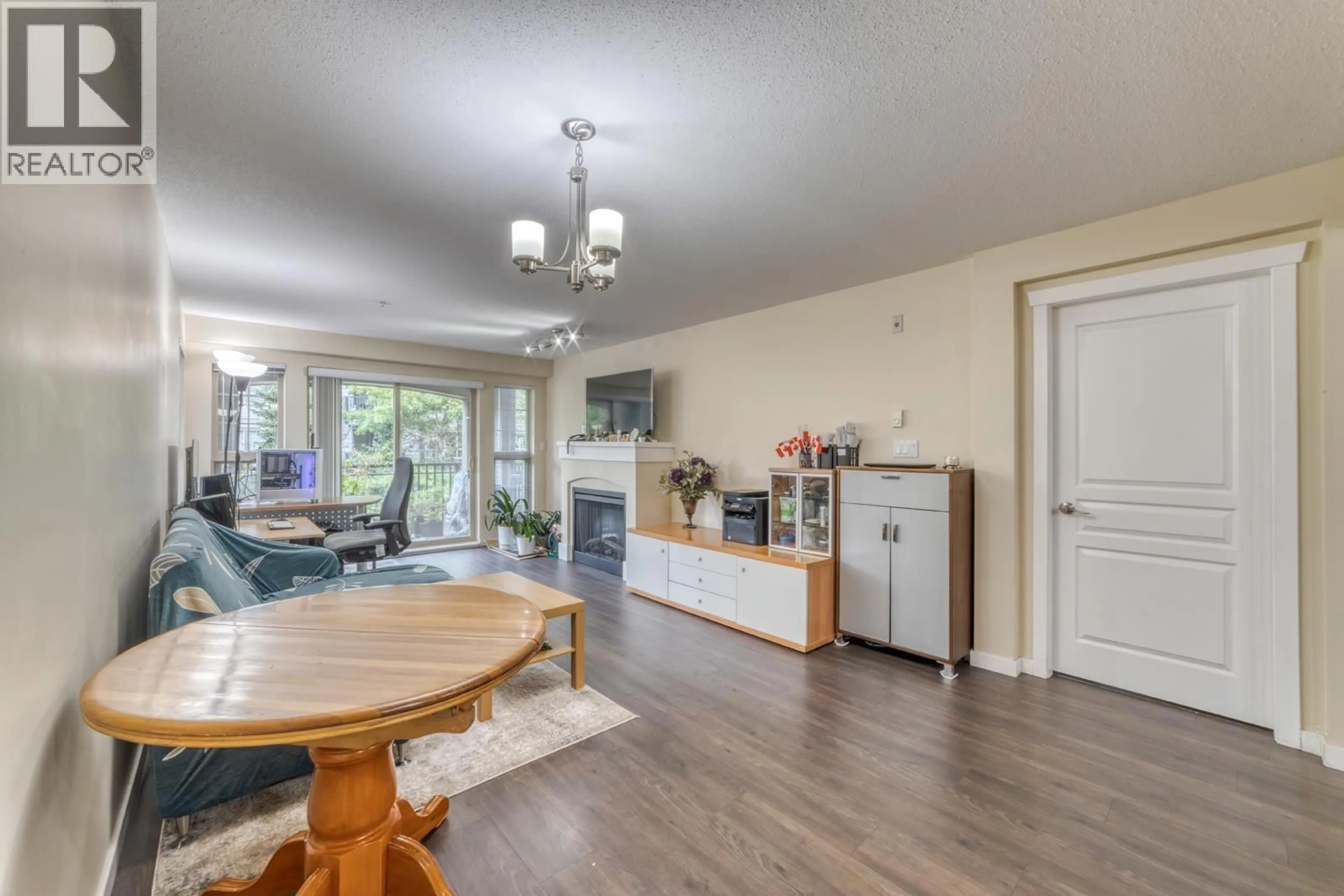 Living room with furniture, wood/laminate floor for 314 - 2958 SILVER SPRINGS BOULEVARD, Coquitlam British Columbia V3E3R9