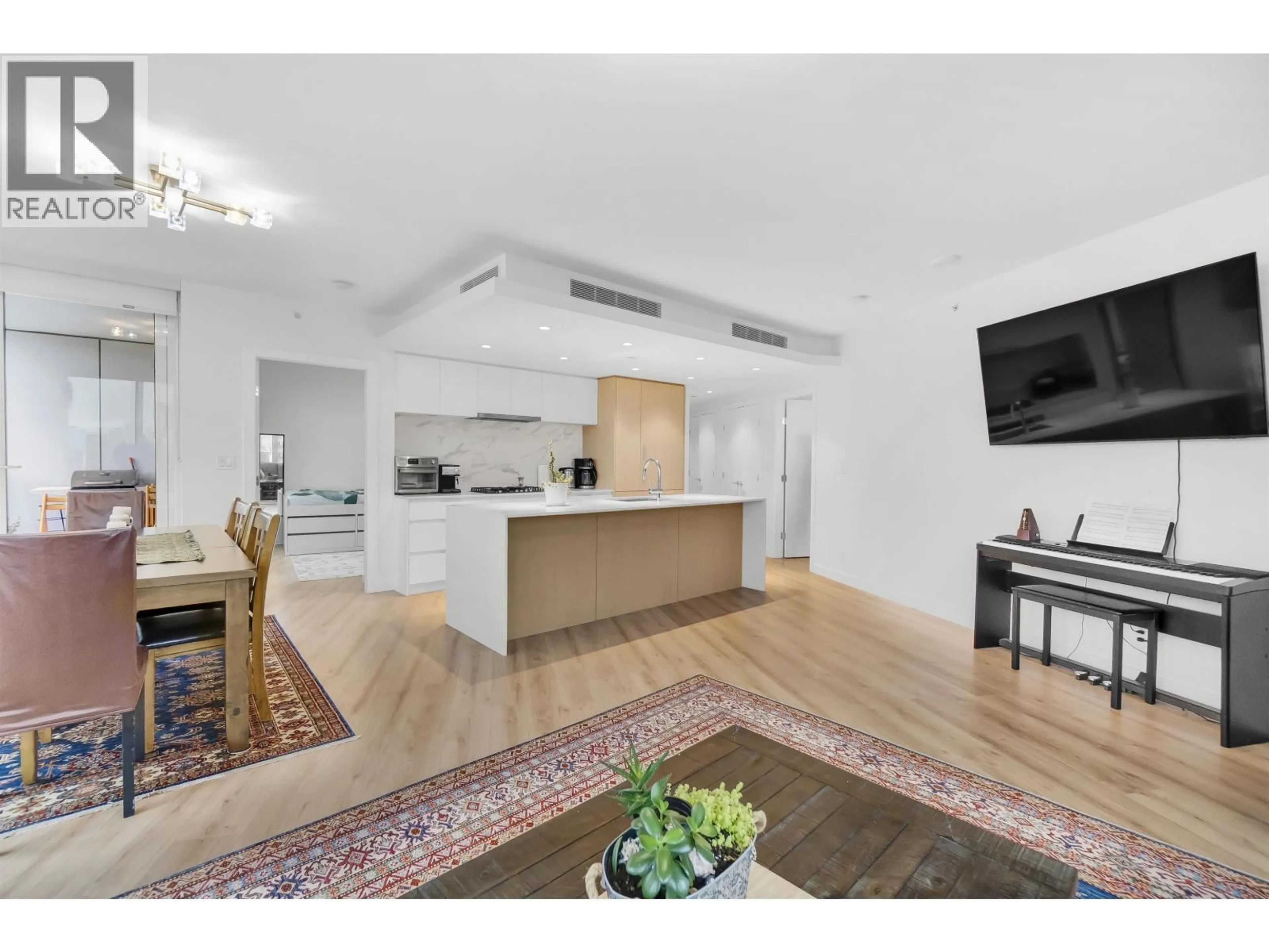Open concept kitchen, wood/laminate floor for 412 - 1500 FERN STREET, North Vancouver British Columbia V7J0E6