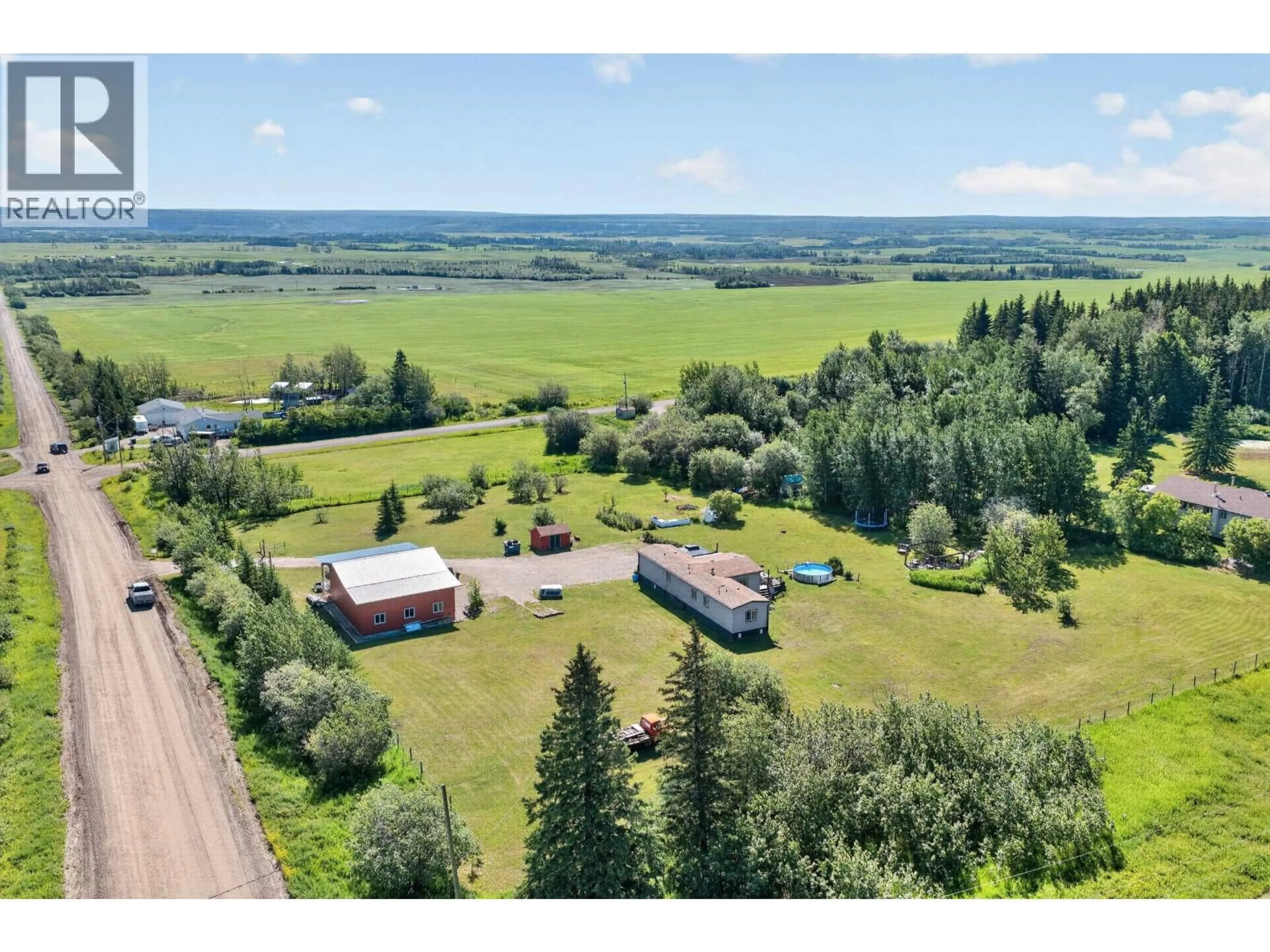 A pic from outside/outdoor area/front of a property/back of a property/a pic from drone, unknown for 6419 NORTH PINE ROAD, Fort St. John British Columbia V0C2A0