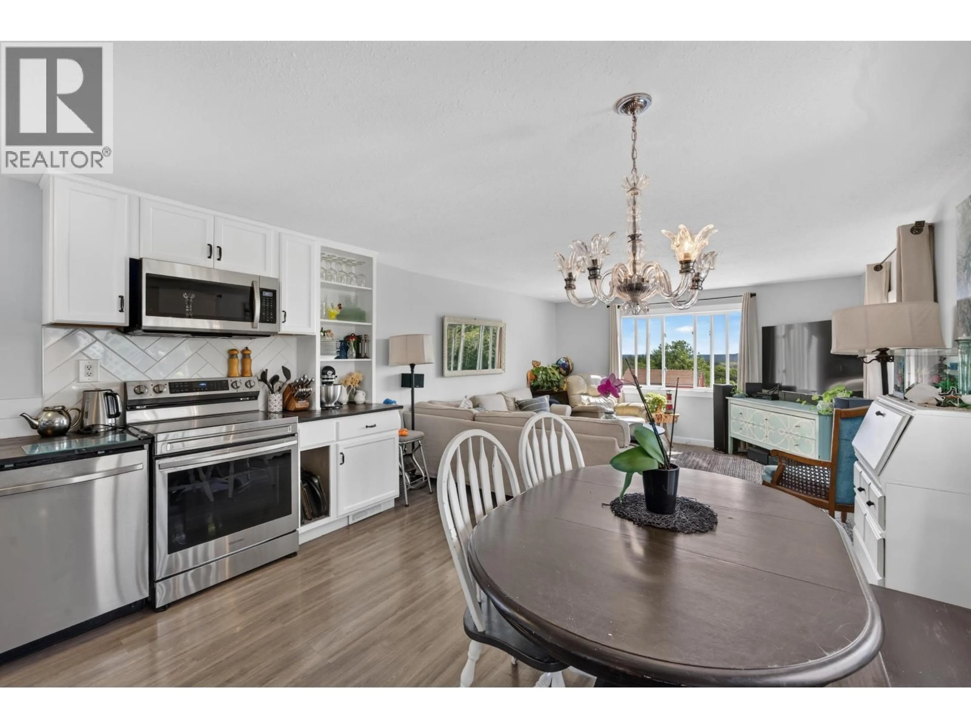 Open concept kitchen, wood/laminate floor for 6419 NORTH PINE ROAD, Fort St. John British Columbia V0C2A0