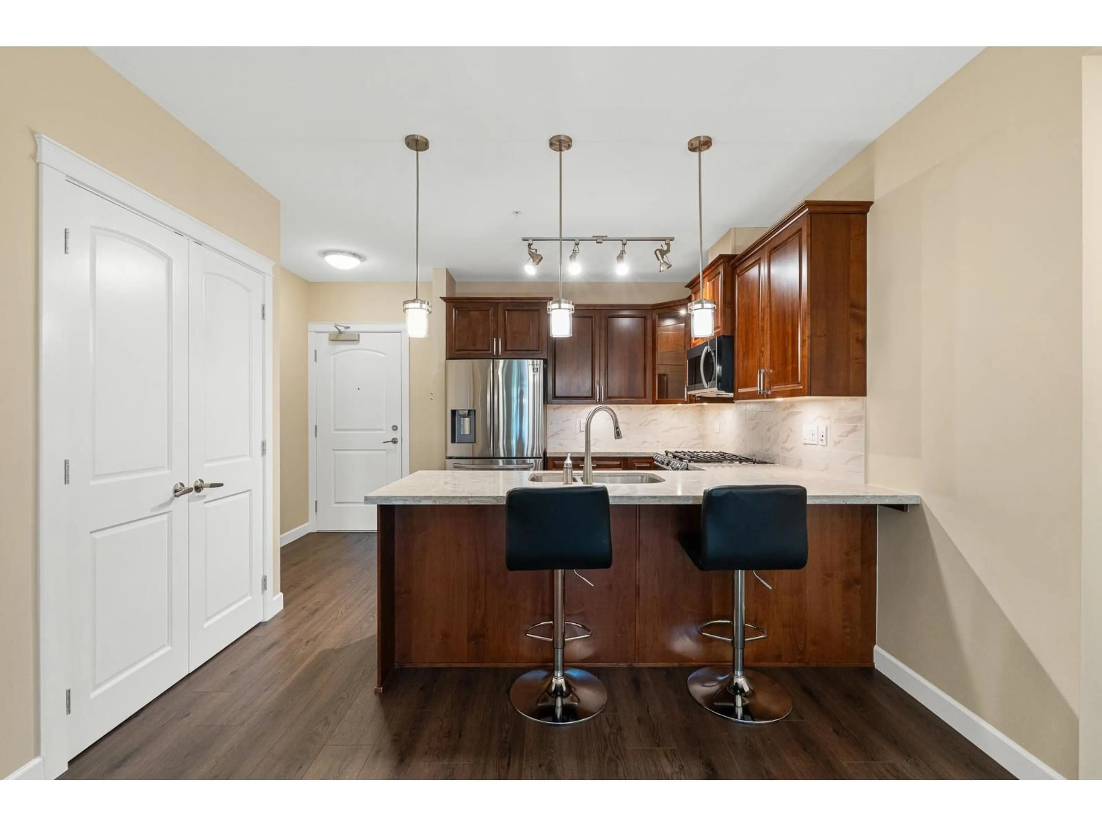 Open concept kitchen, wood/laminate floor for 302 - 8561 203A STREET, Langley British Columbia V2Y3R1