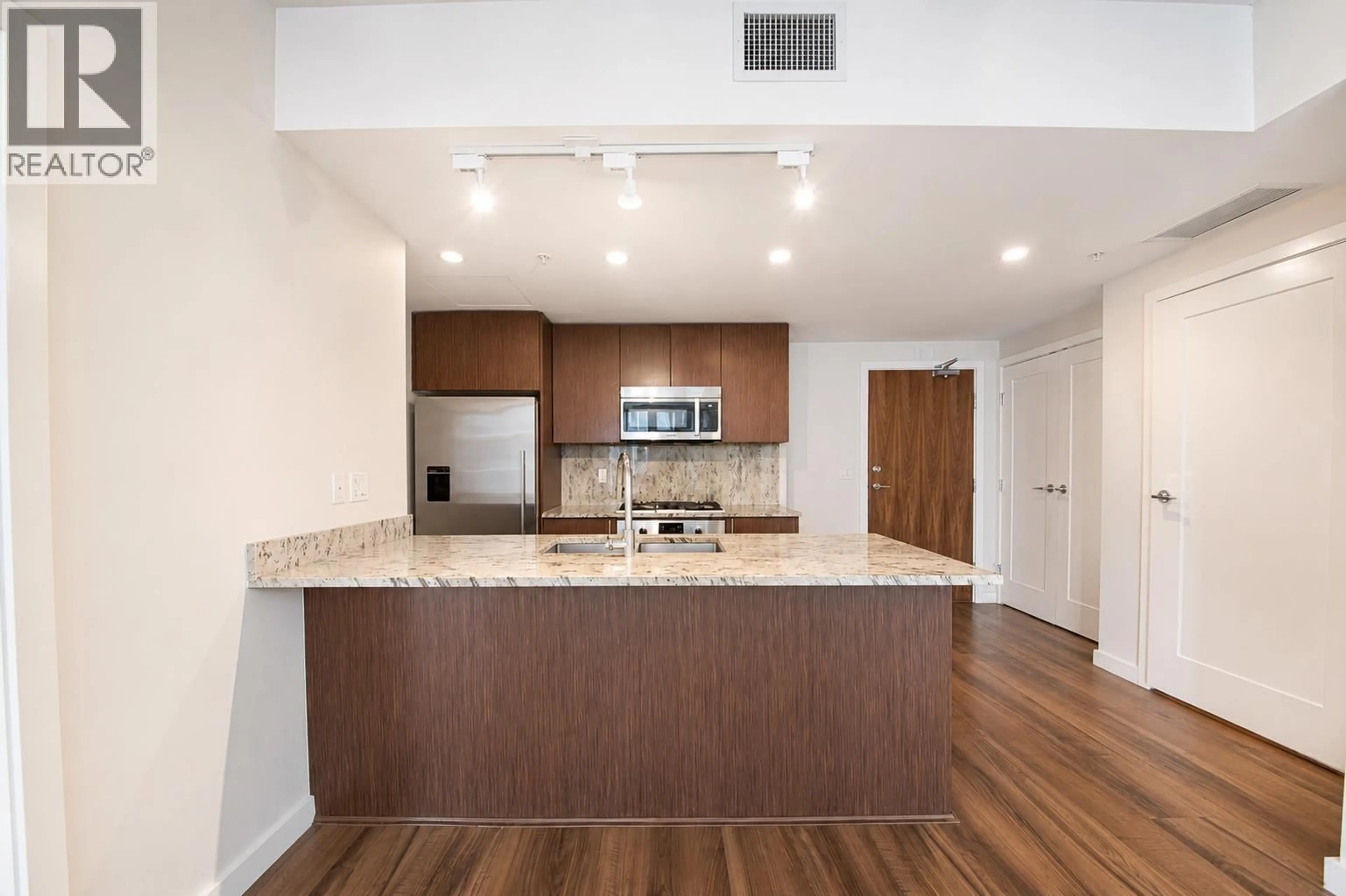 Open concept kitchen, wood/laminate floor for 812 - 8688 HAZELBRIDGE WAY, Richmond British Columbia V6X0R6