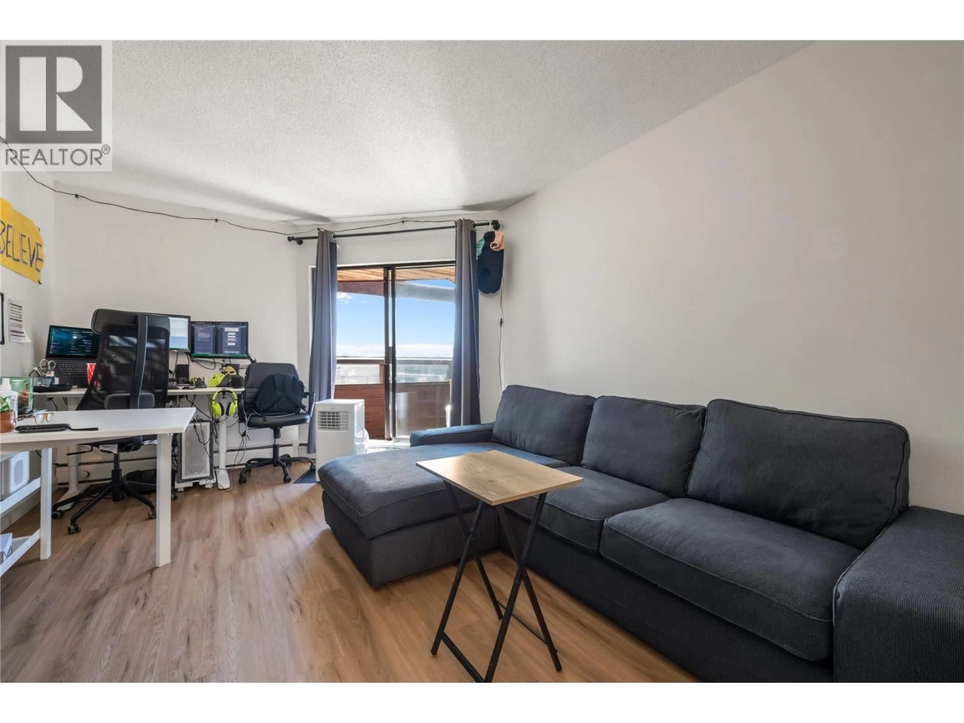 Living room with furniture, wood/laminate floor for 313 - 1177 HOWIE AVENUE AVENUE, Coquitlam British Columbia V3J1T9