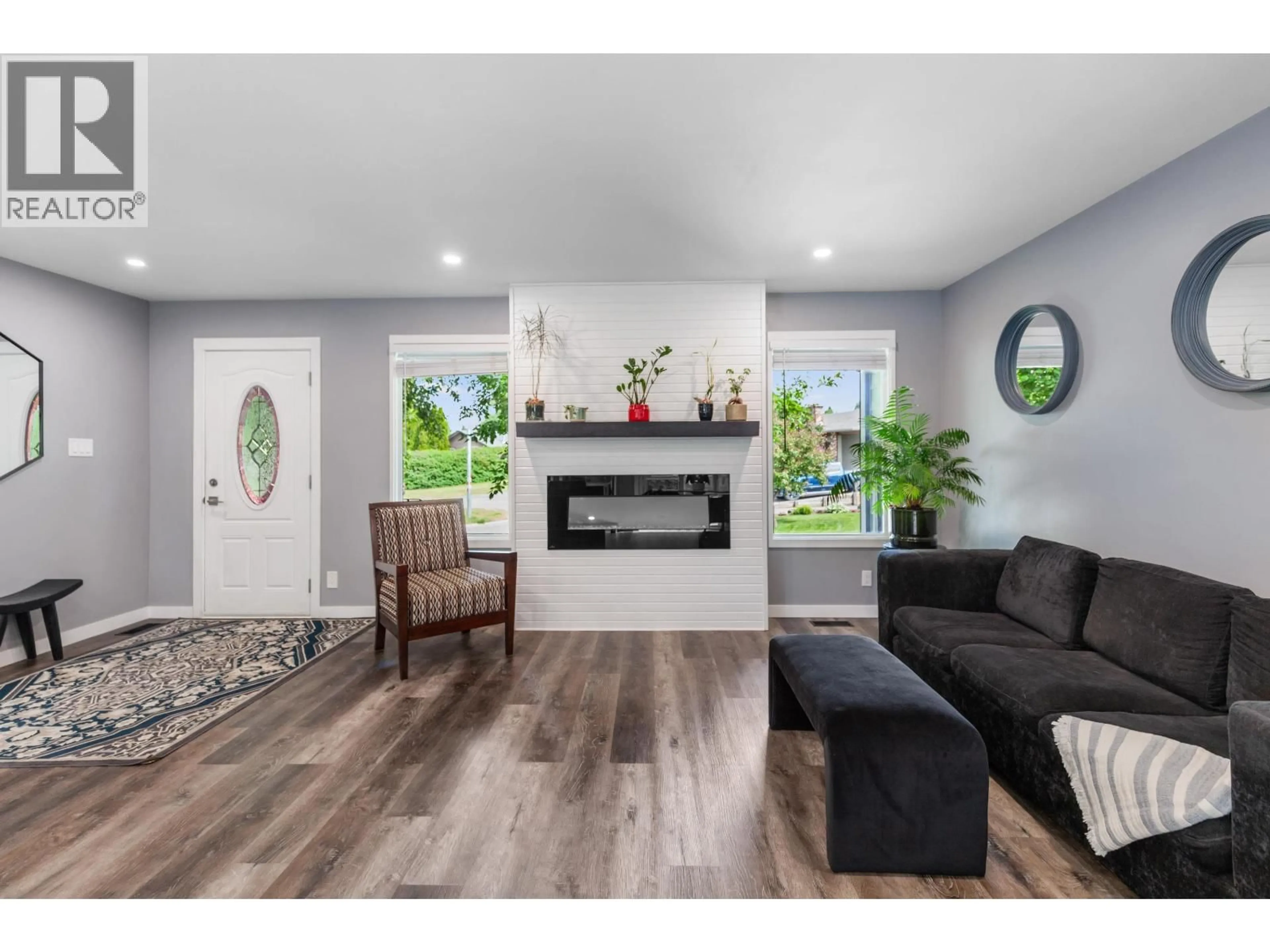 Living room with furniture, wood/laminate floor for 7197 GUELPH CRESCENT, Prince George British Columbia V2N4A2