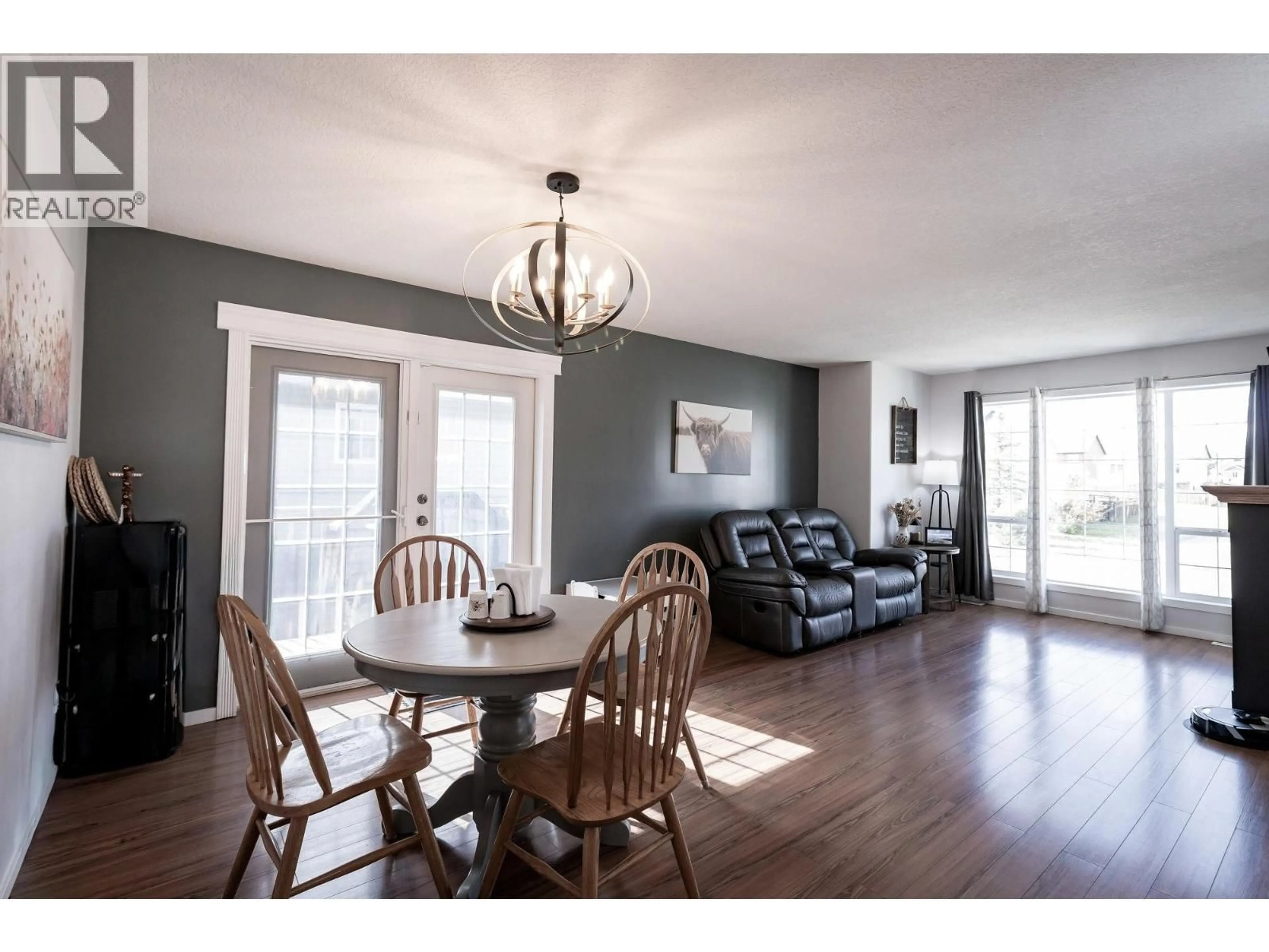 Dining room, wood/laminate floor for 8227 86 AVENUE, Fort St. John British Columbia V1J0G4