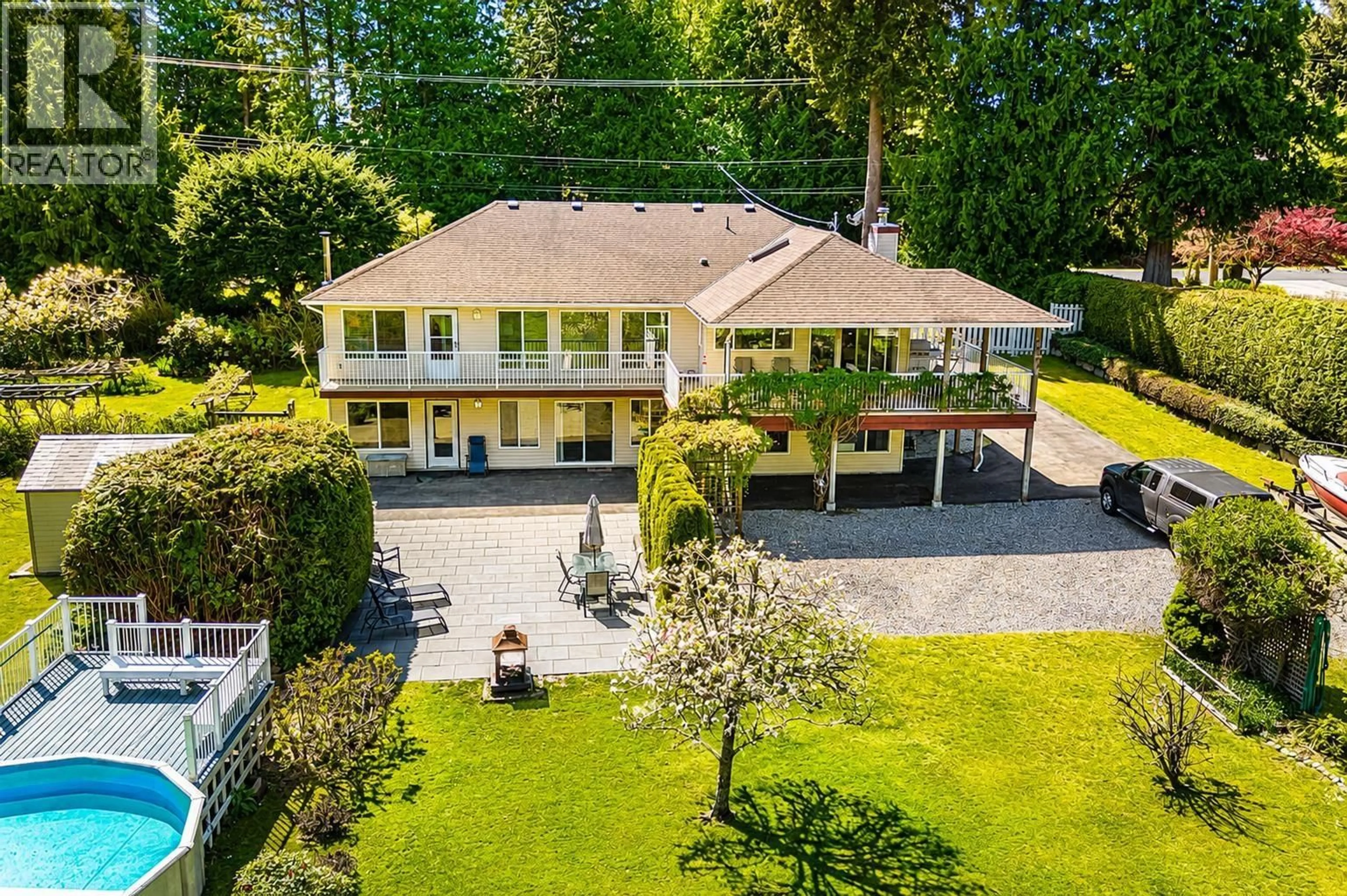 A pic from outside/outdoor area/front of a property/back of a property/a pic from drone, street for 7904 REDROOFFS ROAD, Halfmoon Bay British Columbia V7Z1A4