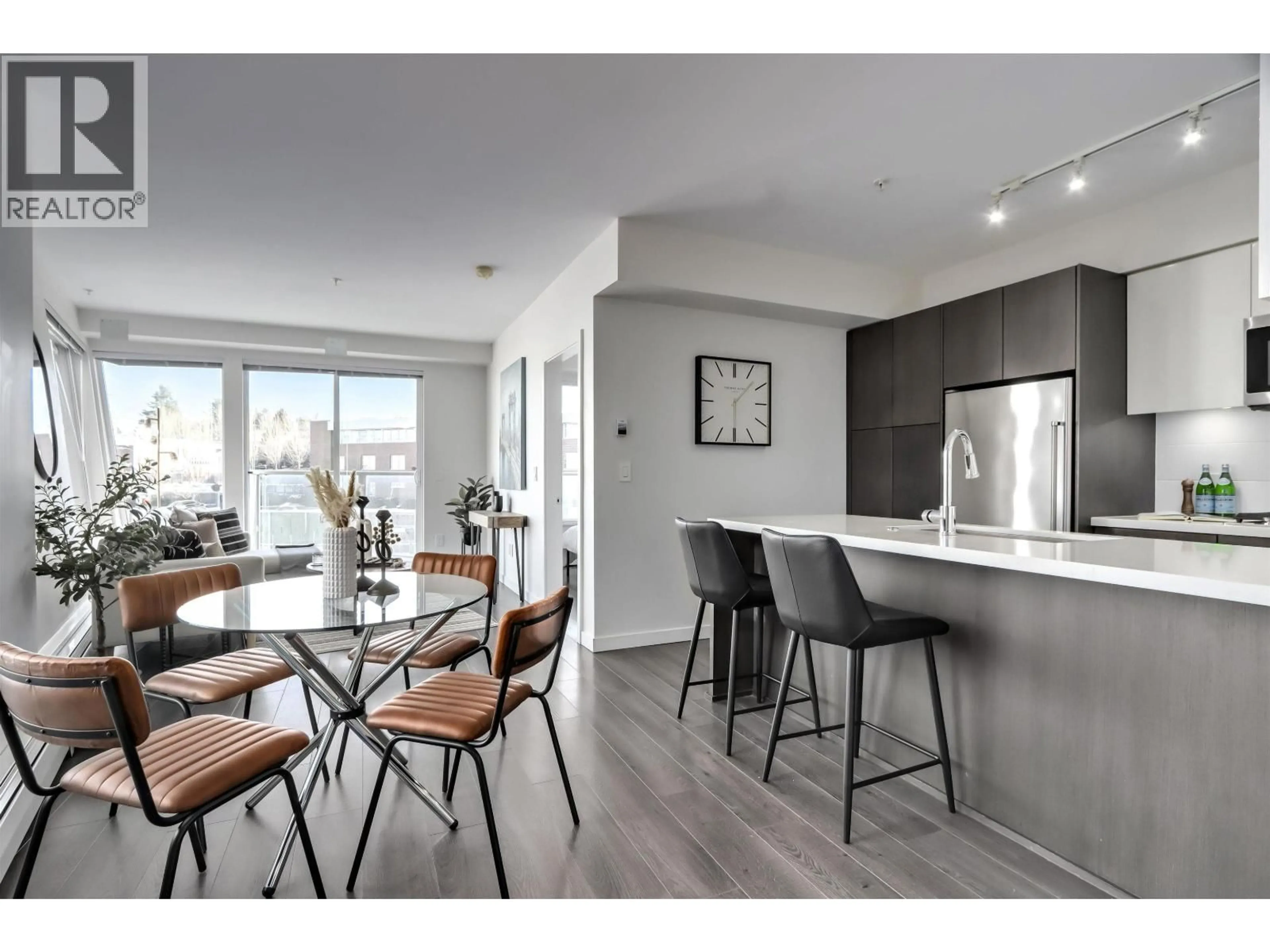 Open concept kitchen, wood/laminate floor for 313 - 417 GREAT NORTHERN WAY, Vancouver British Columbia V5T0G7