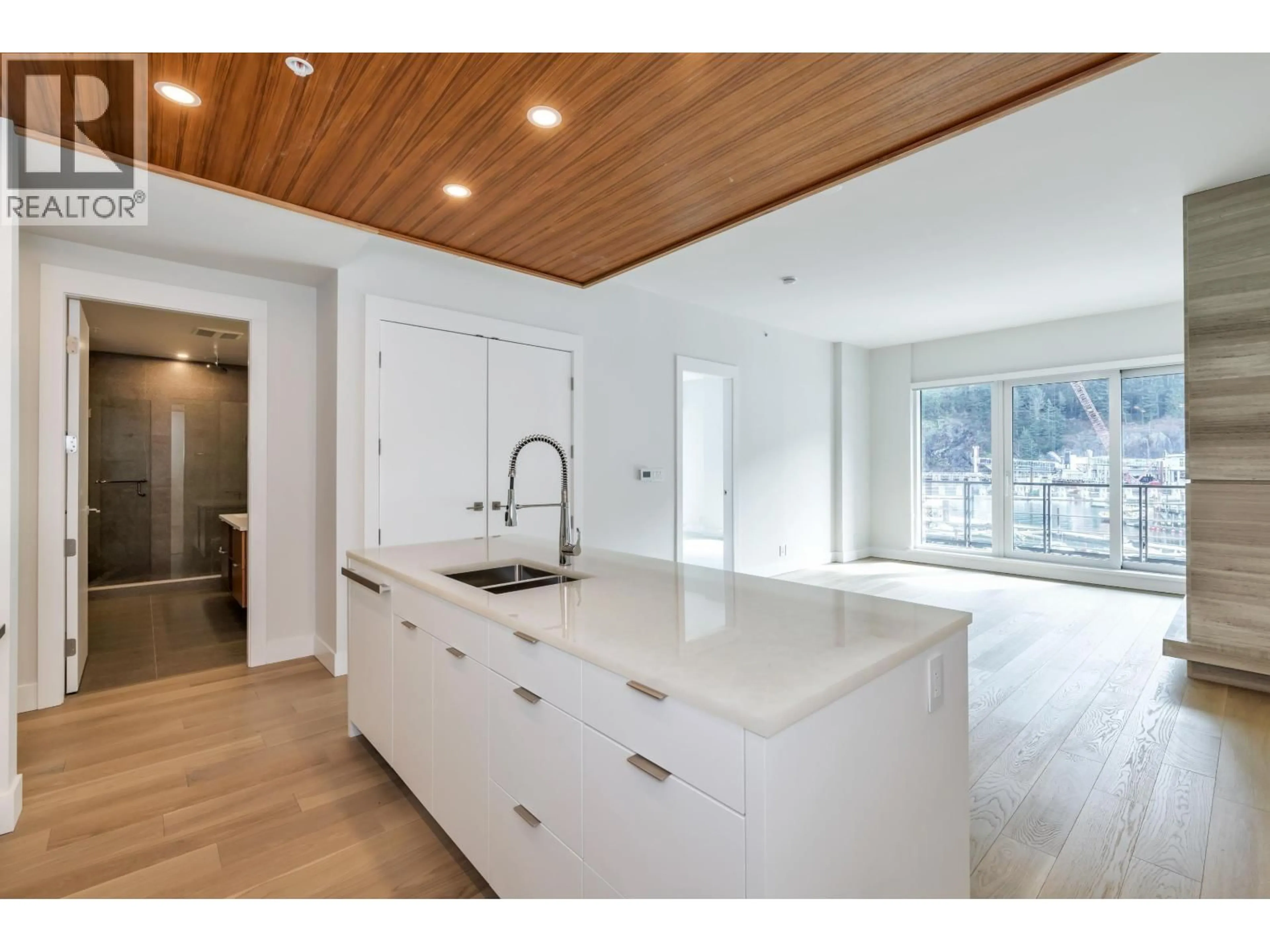 Open concept kitchen, wood/laminate floor for 305 - 6707 NELSON AVENUE, West Vancouver British Columbia V7W2B2