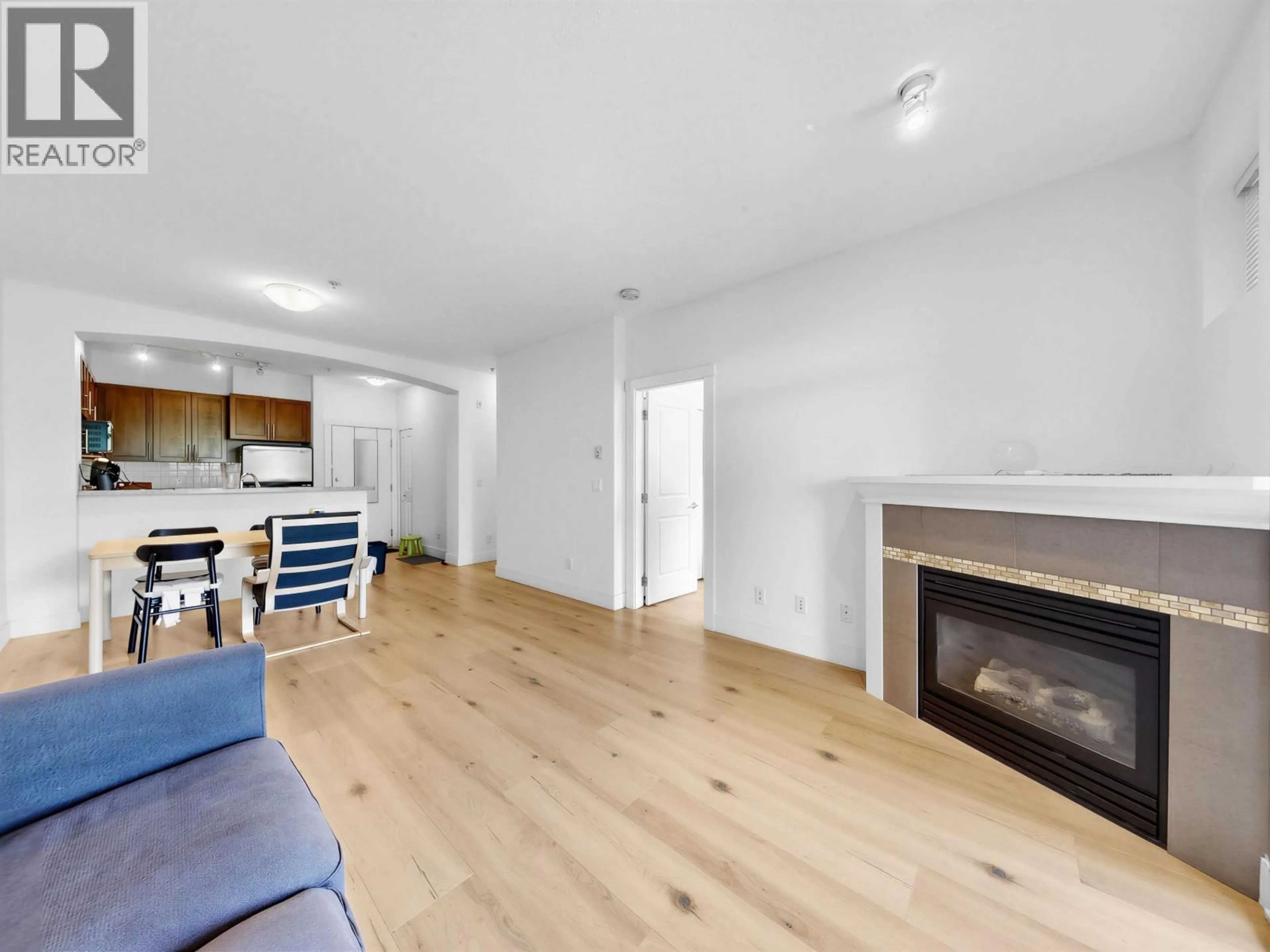 Living room with furniture, wood/laminate floor for 319 - 2250 WESBROOK MALL, Vancouver British Columbia V6T0A6