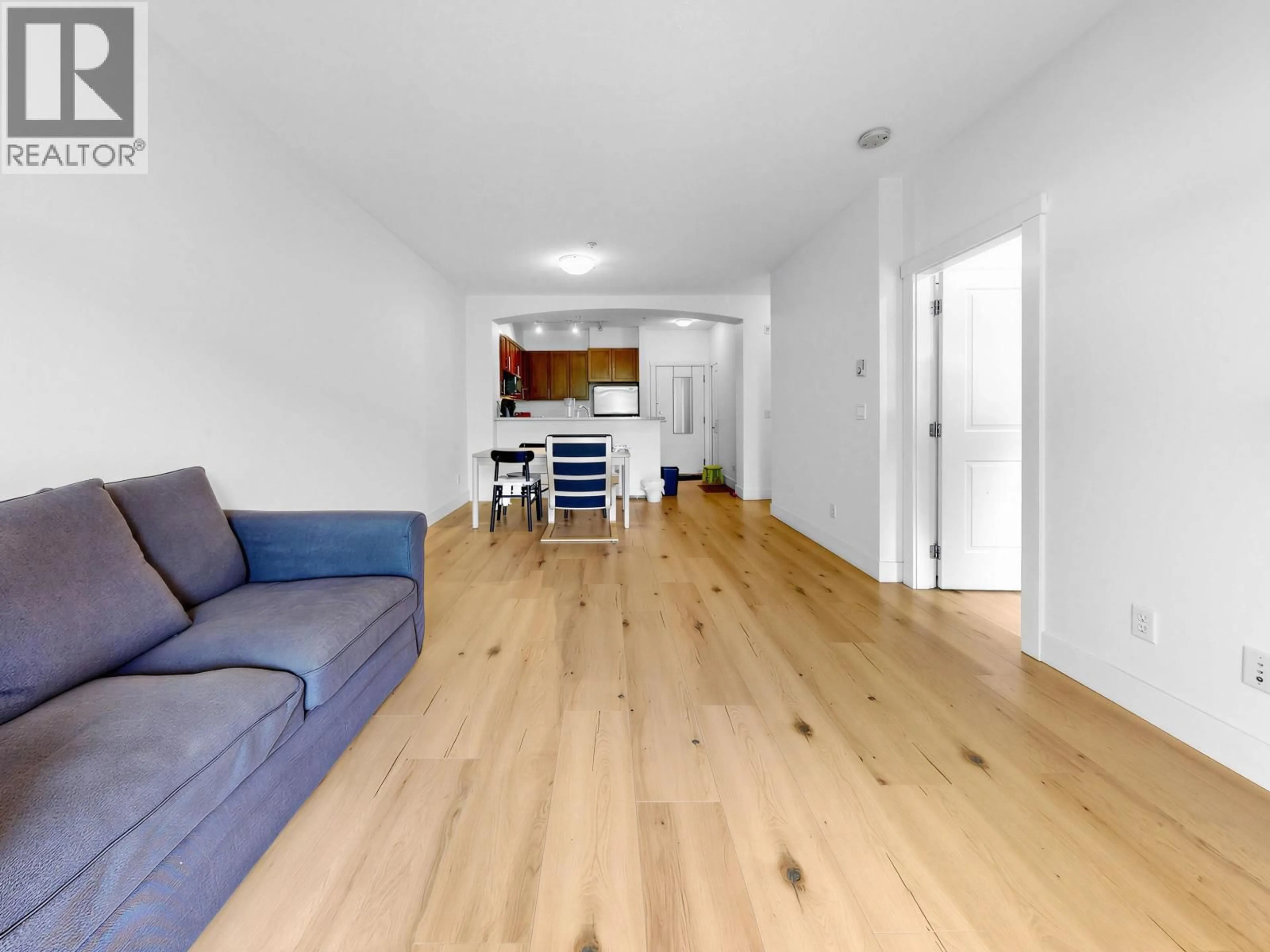 Living room with furniture, wood/laminate floor for 319 - 2250 WESBROOK MALL, Vancouver British Columbia V6T0A6