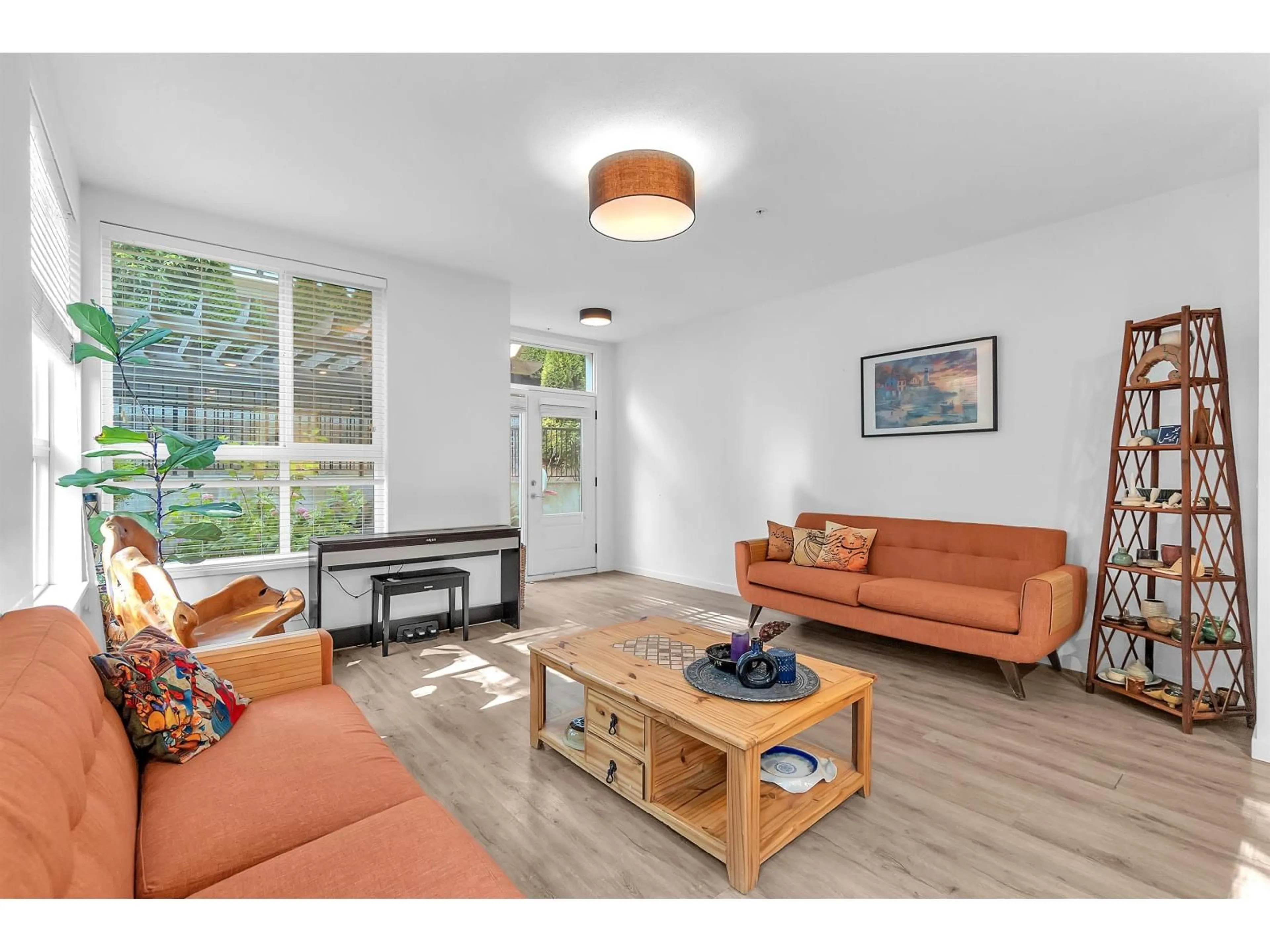 Living room with furniture, wood/laminate floor for B210 - 20087 68 AVENUE, Langley British Columbia V2Y0Y3