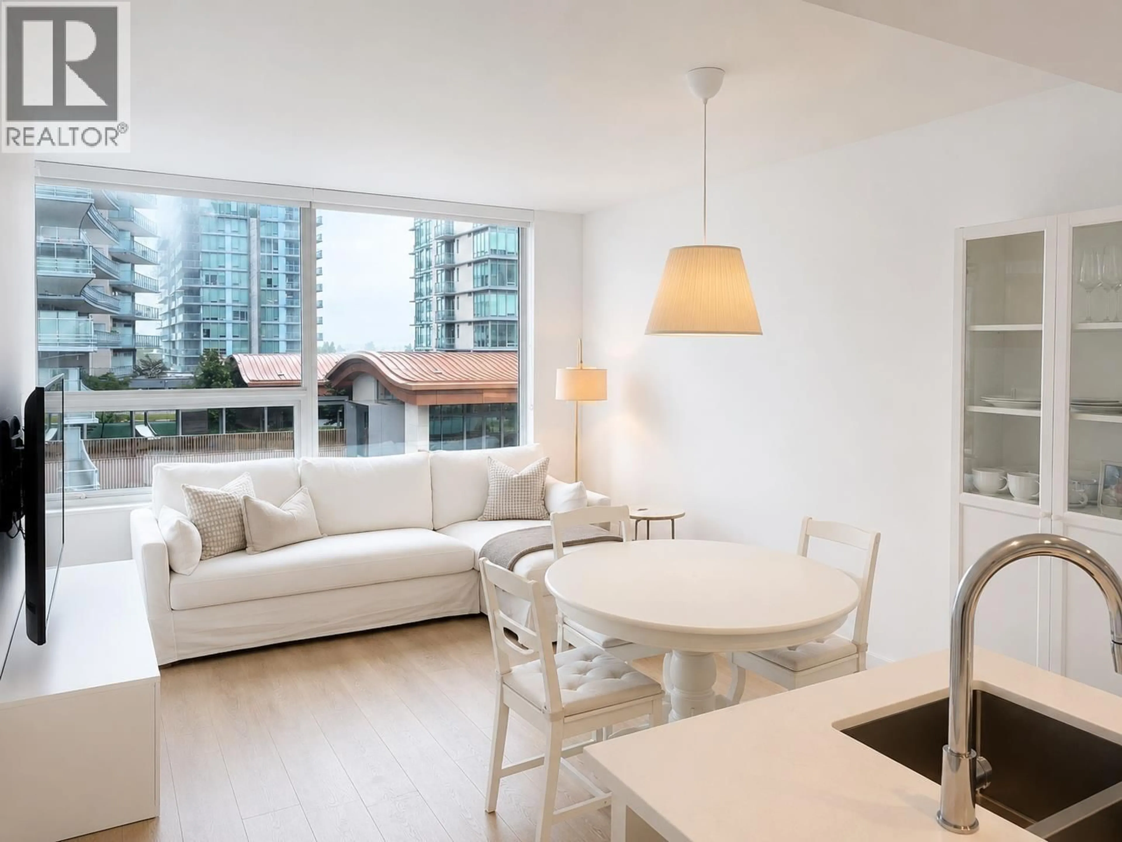Living room with furniture, wood/laminate floor for 513 - 5508 HOLLYBRIDGE WAY, Richmond British Columbia V7C0C7
