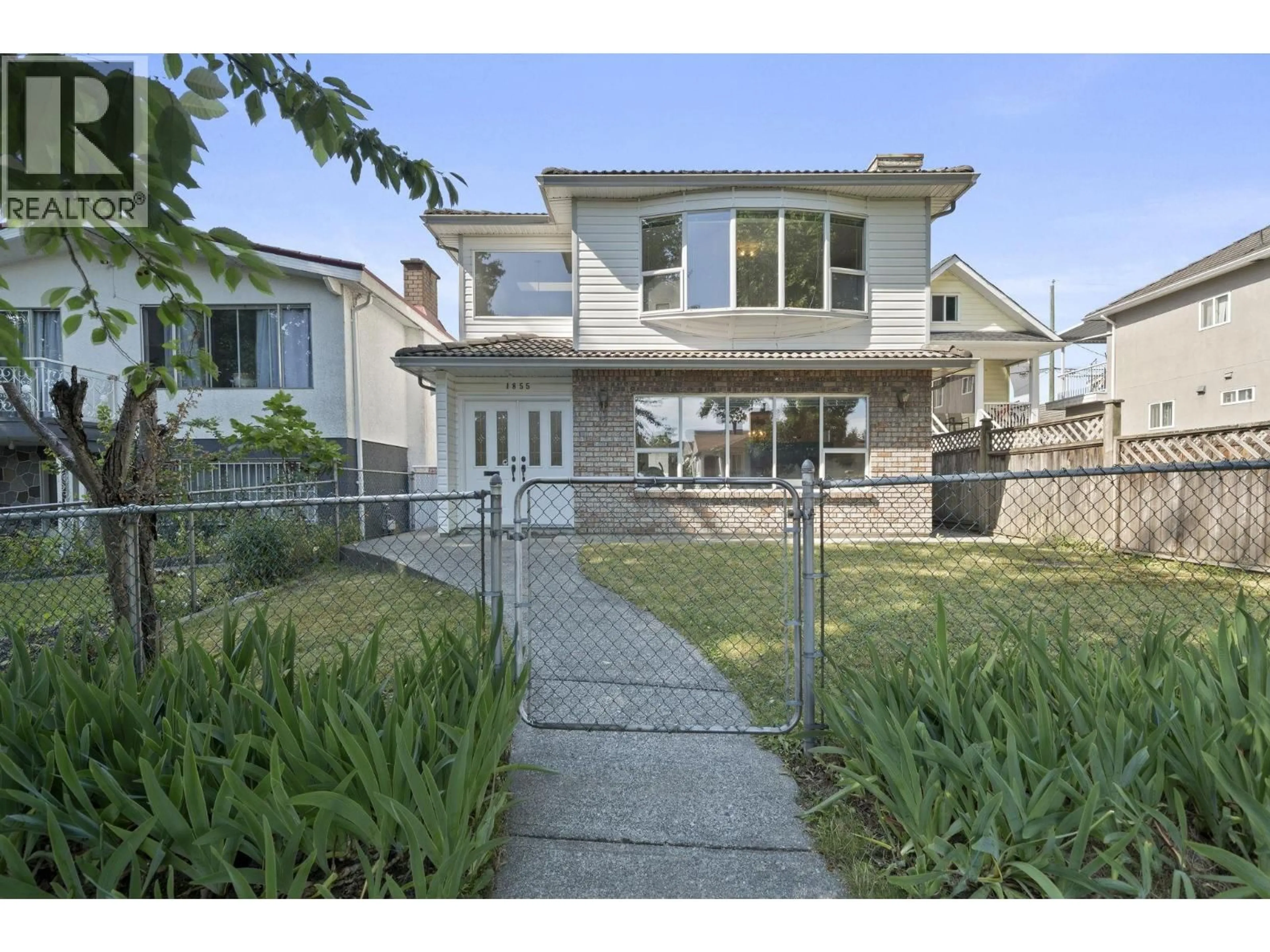 Home with vinyl exterior material, street for 1855 53RD AVENUE, Vancouver British Columbia V5P1X5