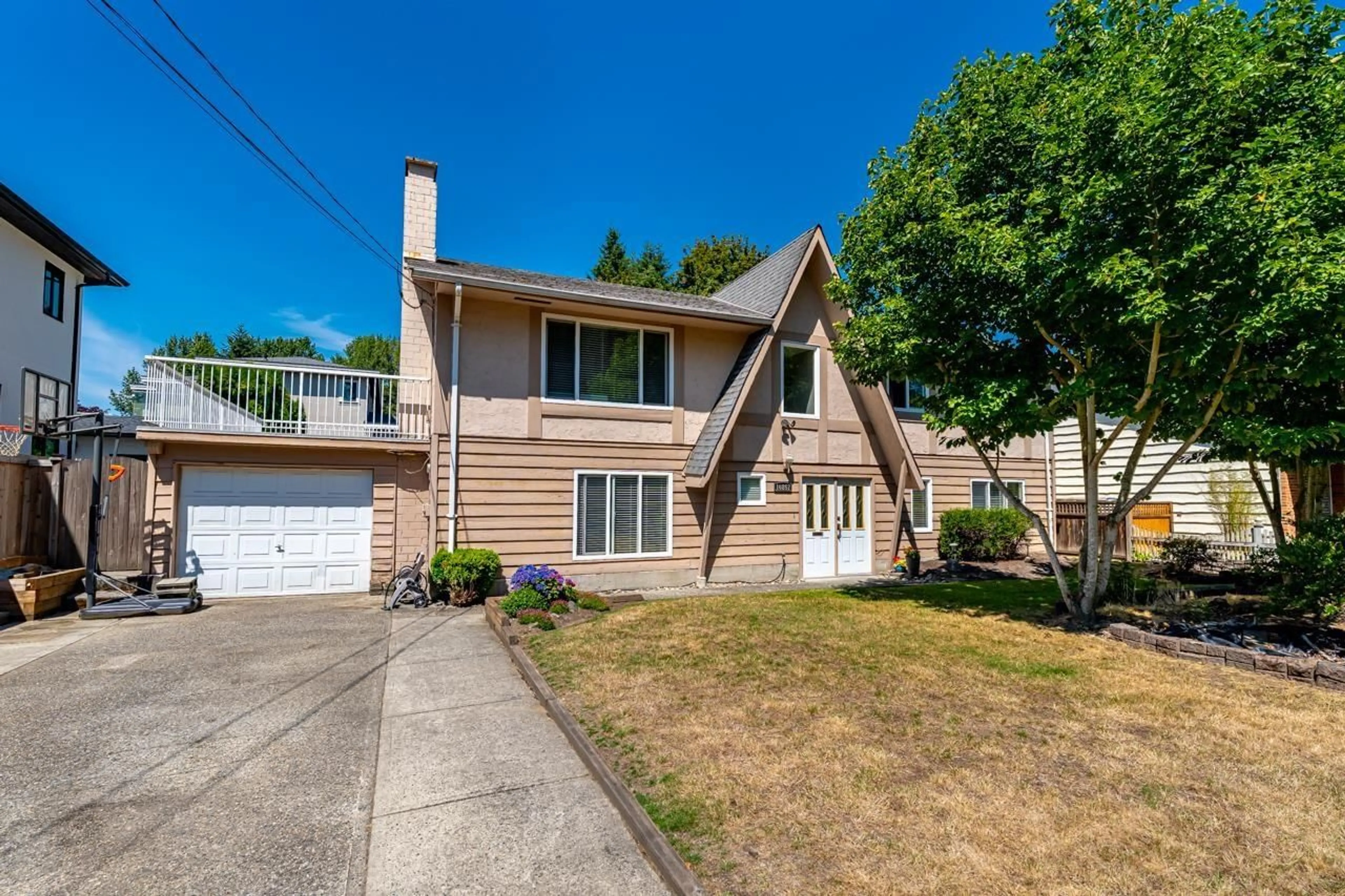 Home with vinyl exterior material, street for 10867 64A AVENUE, Delta British Columbia V4E1E2