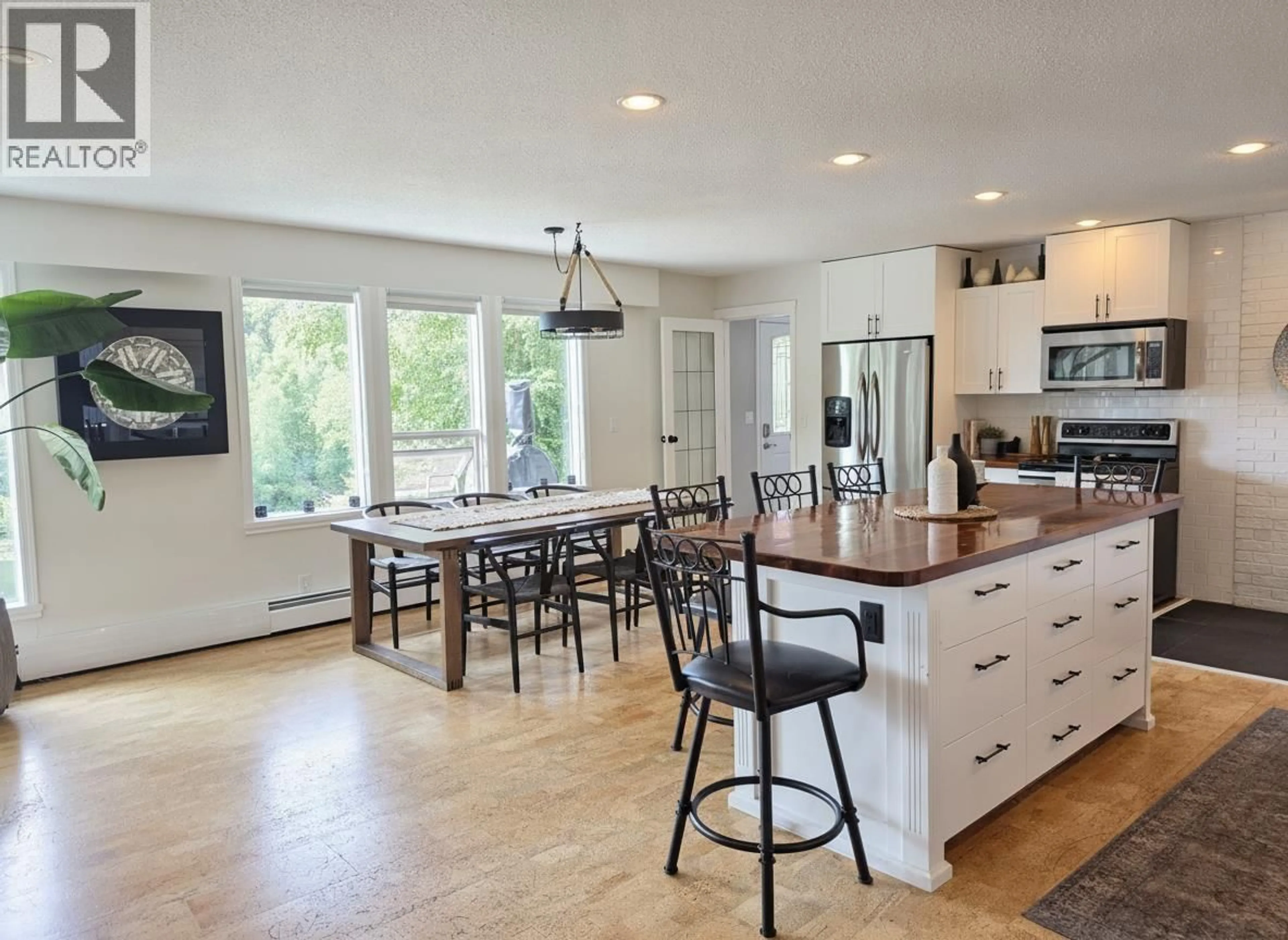 Open concept kitchen, wood/laminate floor for 9875 LAKESHORE DRIVE, Prince George British Columbia V2K5M8
