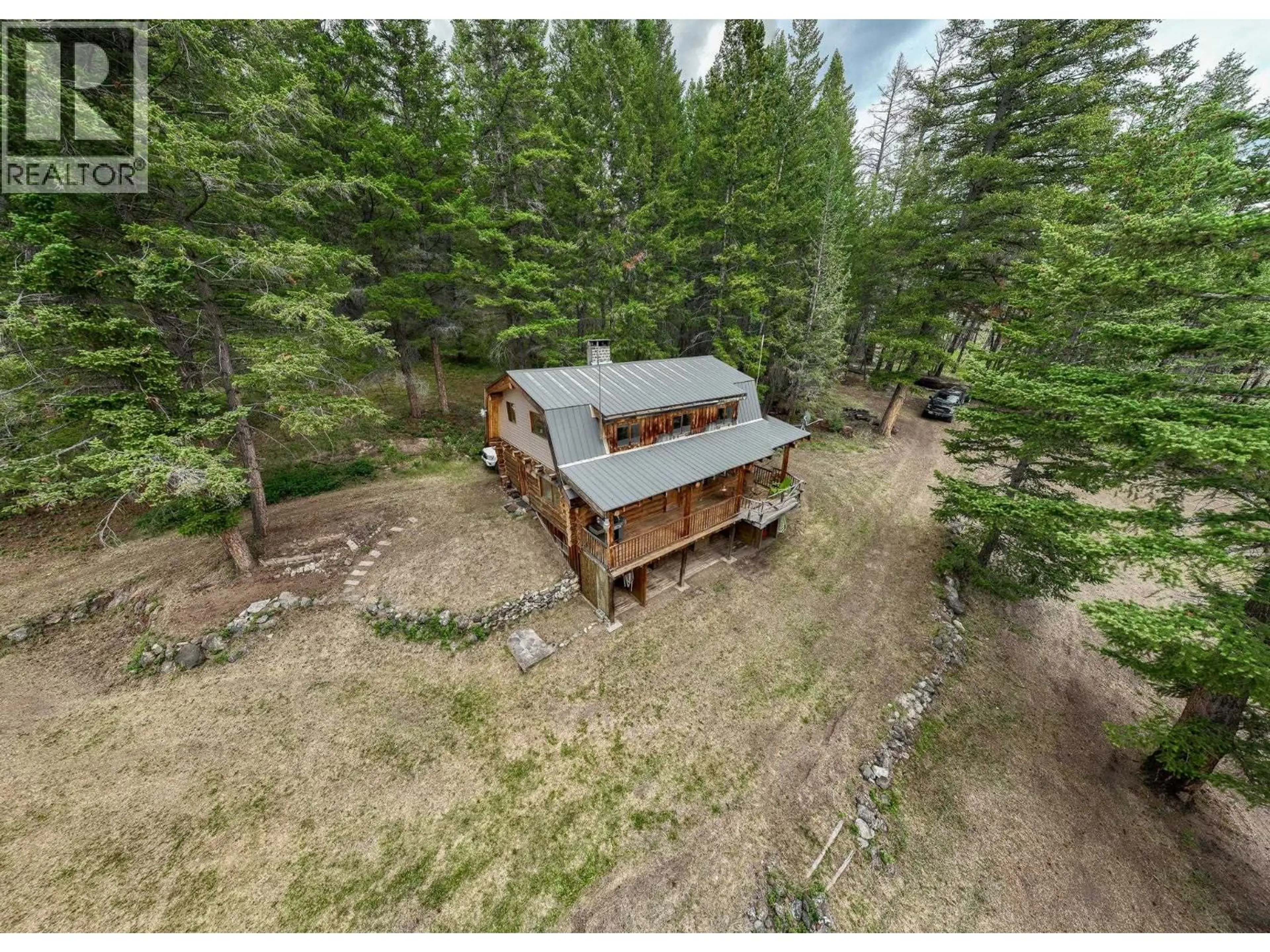 A pic from outside/outdoor area/front of a property/back of a property/a pic from drone, forest/trees view for 6425 BOULE YOUNG LAKE ROAD, 70 Mile House British Columbia V0K2K2