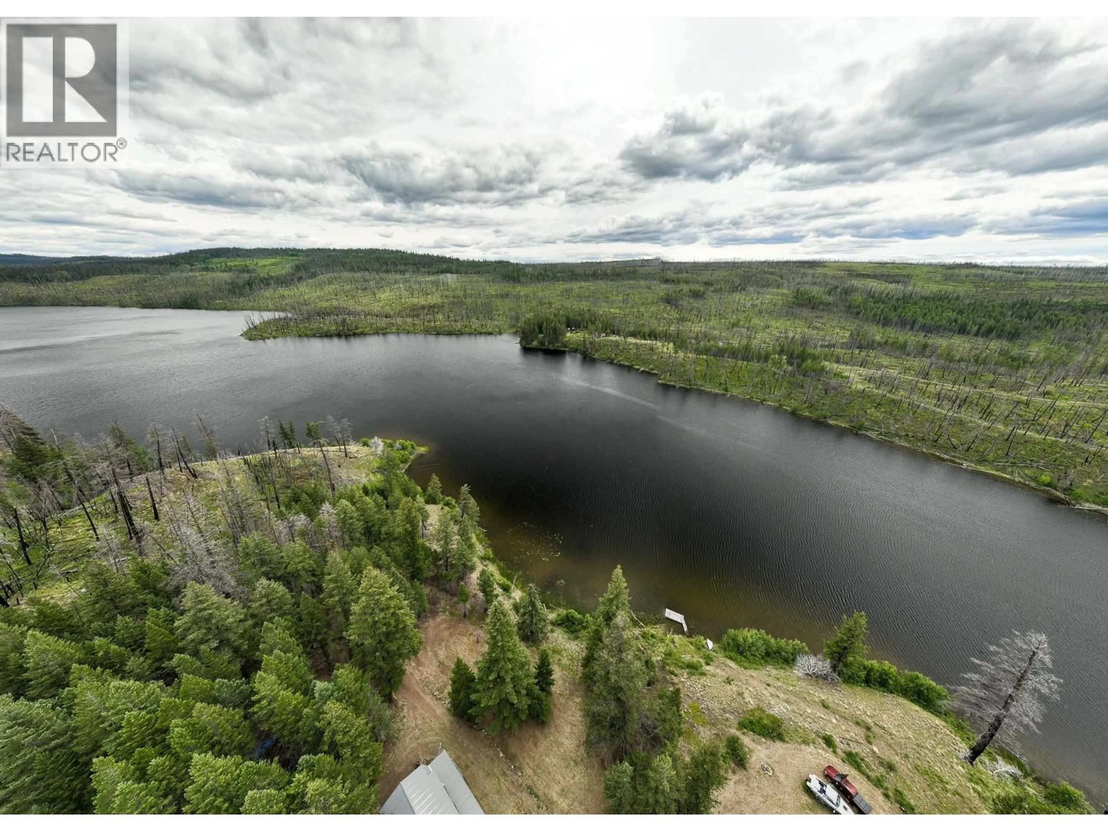 A pic from outside/outdoor area/front of a property/back of a property/a pic from drone, water/lake/river/ocean view for 6425 BOULE YOUNG LAKE ROAD, 70 Mile House British Columbia V0K2K2