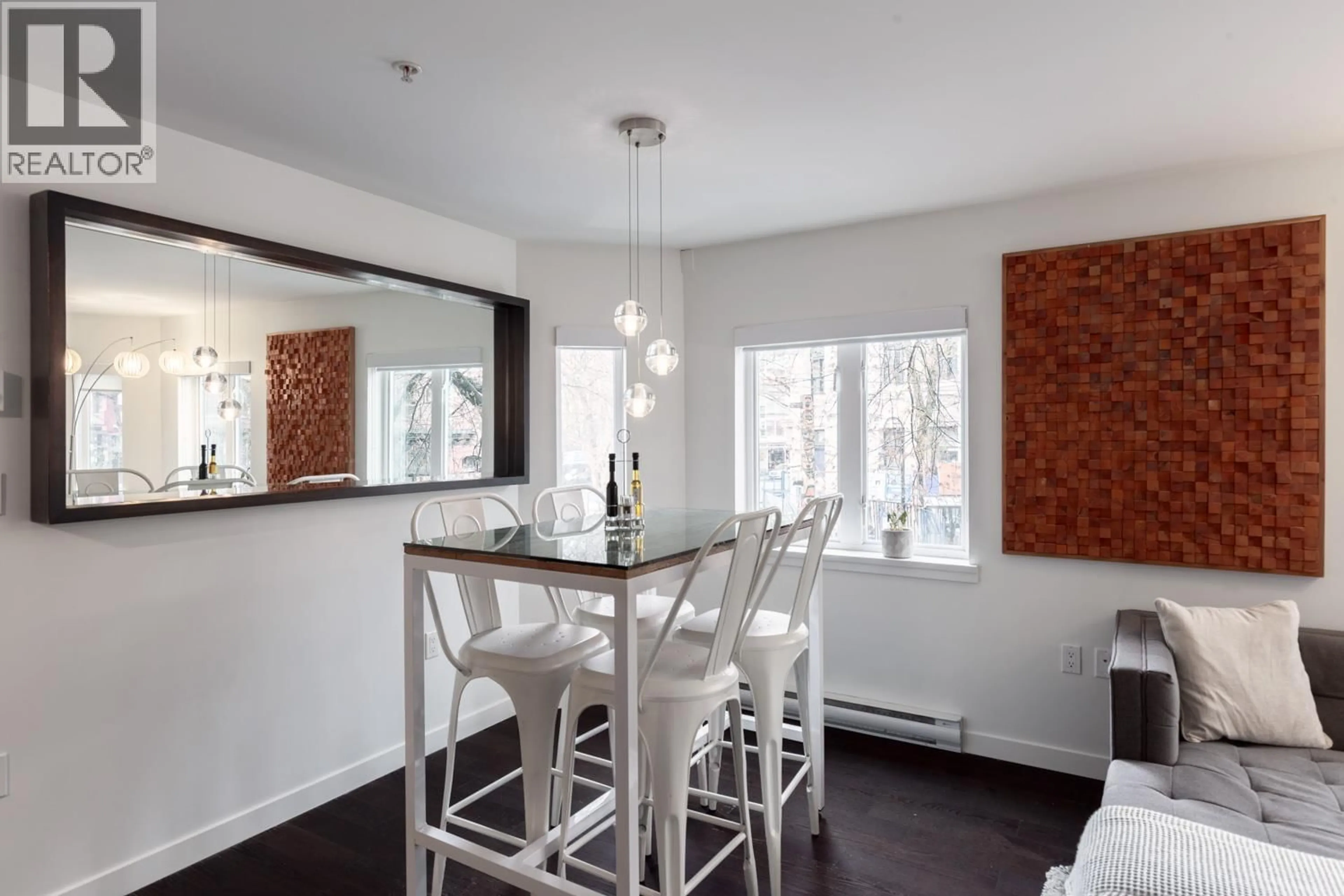 Dining room, wood/laminate floor for 203 - 370 CARRALL STREET, Vancouver British Columbia V6B2J3